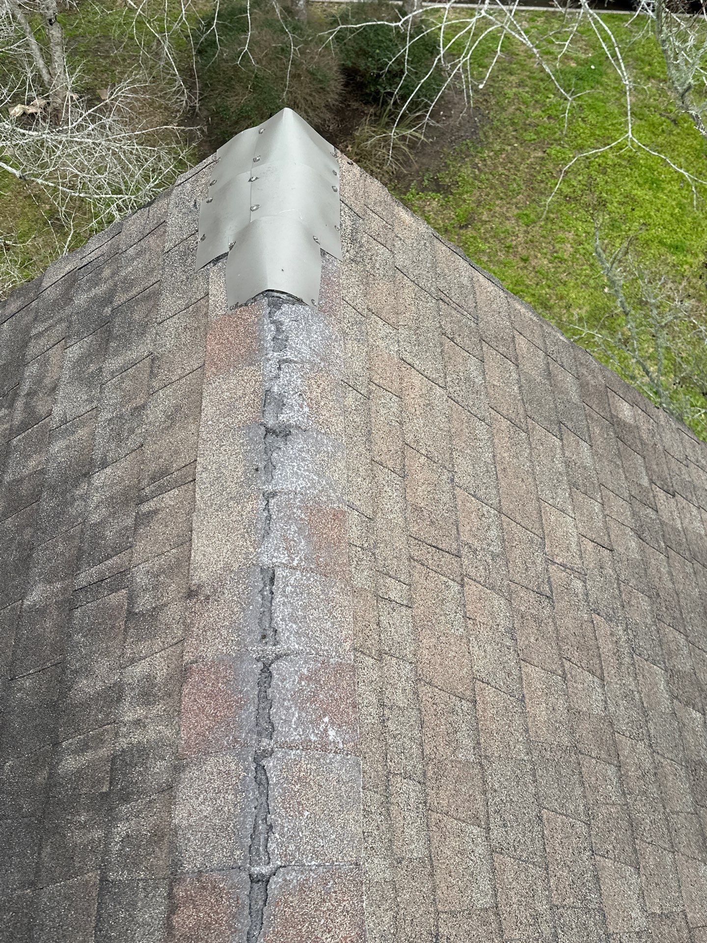 Prior localized shingle patching documented during a Friendswood roof inspection