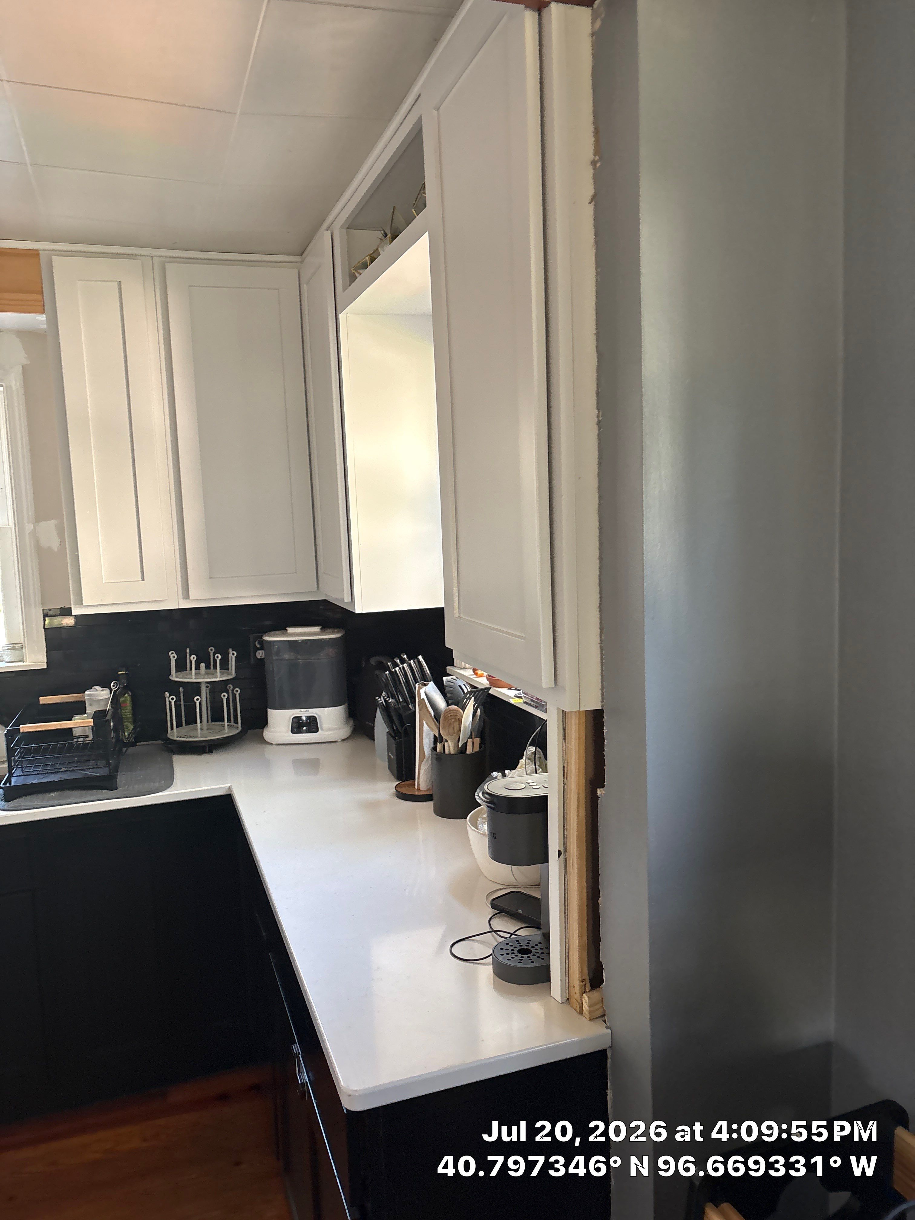 Kitchen Remodel in Lincoln Nebraska Featuring Two-Tone Cabinetry and Black Backsplash by CompanyCam Sales Demo
