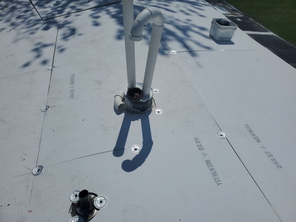 Residential Roofing Installation using 60 mil rubber roof  by Nitro Roofing and Construction