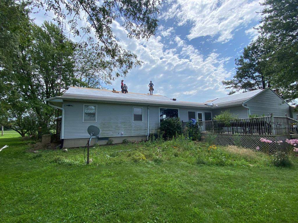 Storm damage roof replacement by Nitro Roofing and Construction
