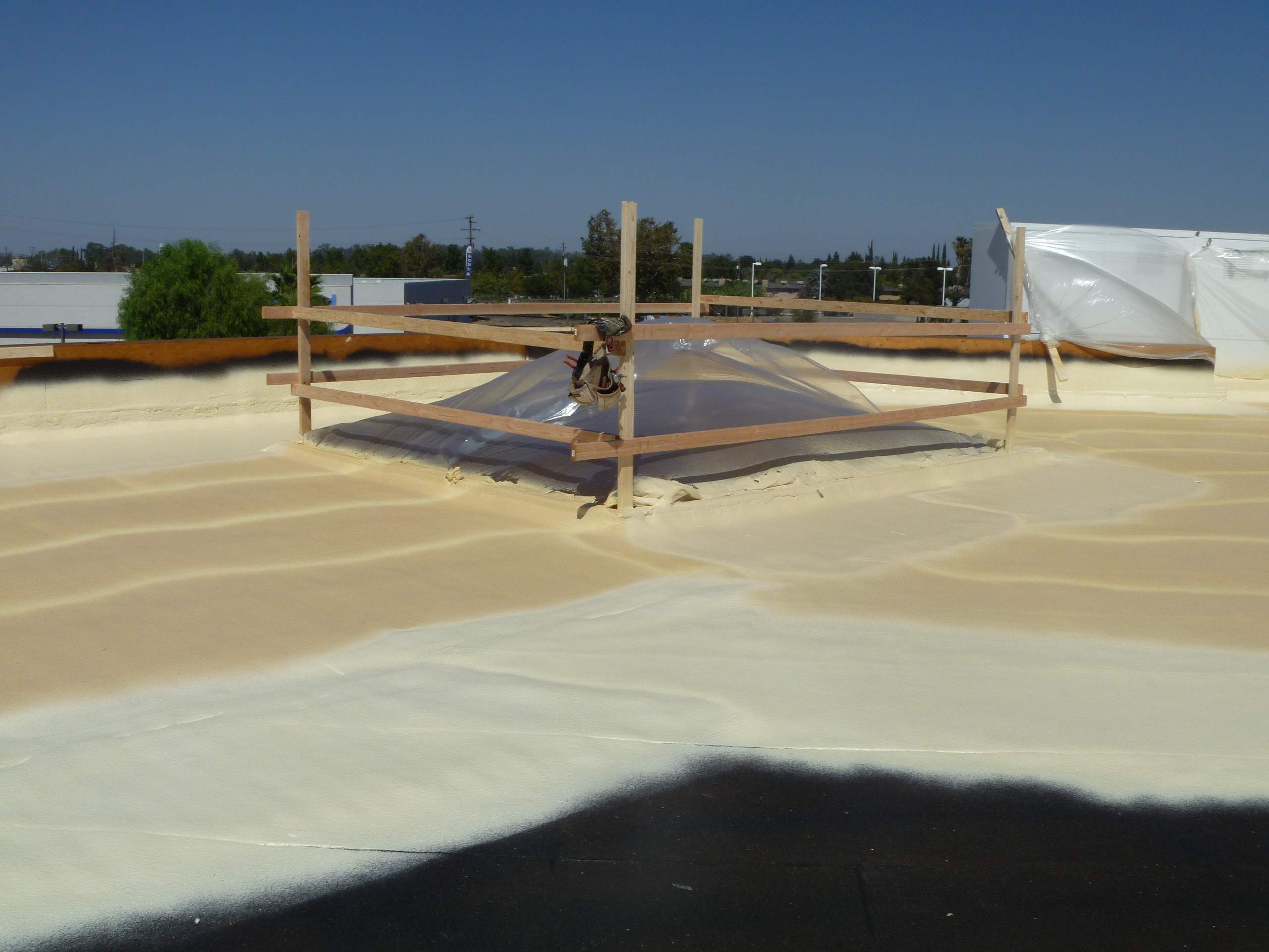 Commercial Roofing Installation using Spray foam and Conklin Benchmark/PUMA XL 18 yr warranty coatings by Straight Edge Roofing Inc