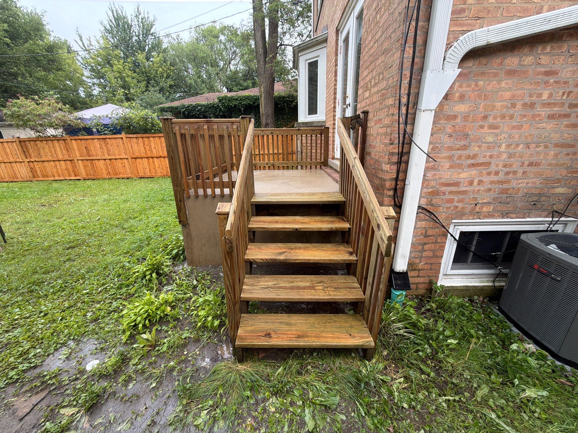 Wood fence cleaning and sealing by Northern Power Washing LLC.