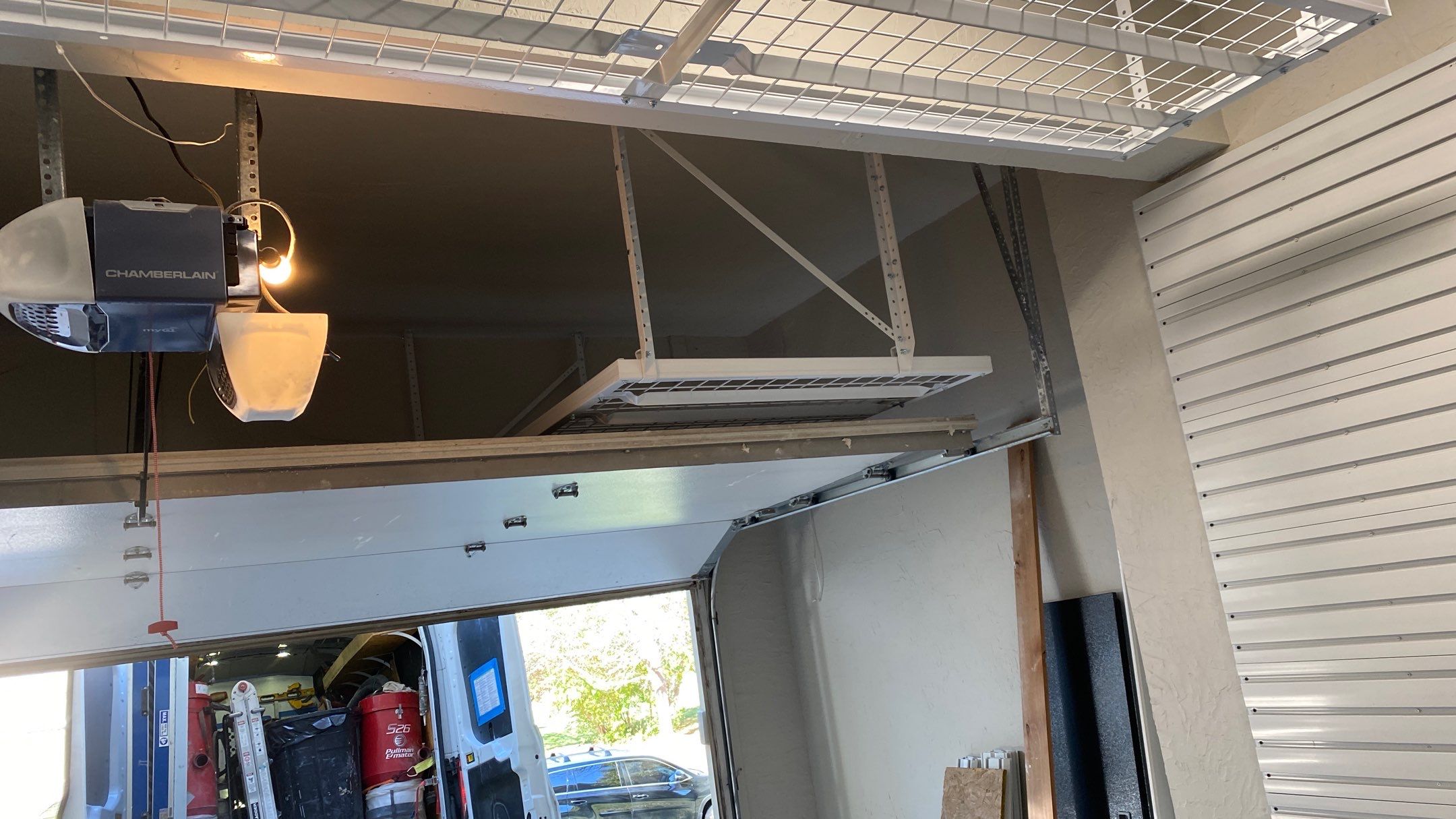 Andrea J. upgrades garage with an overhead ceiling rack!  by Banner Garage