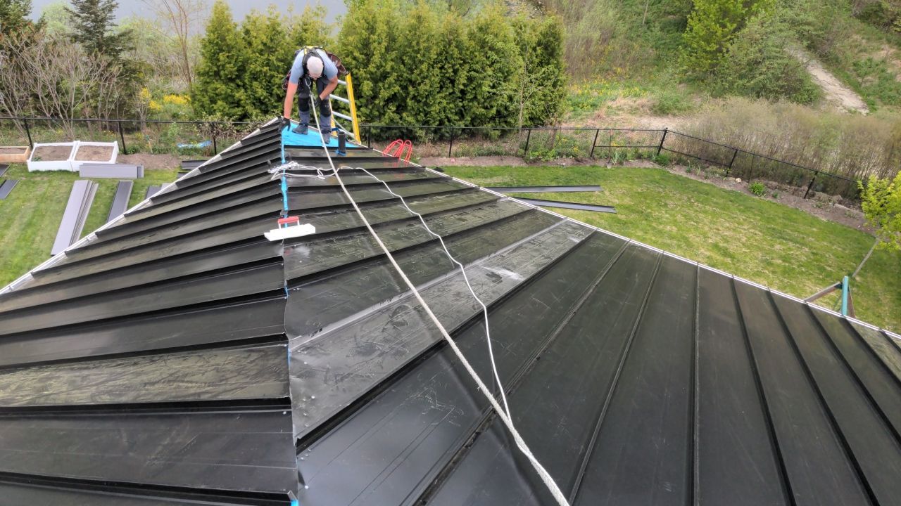 Residential Roofing Installation using 16" Standing Seam Panels by Jay Carter Roofing & Sheet Metal
