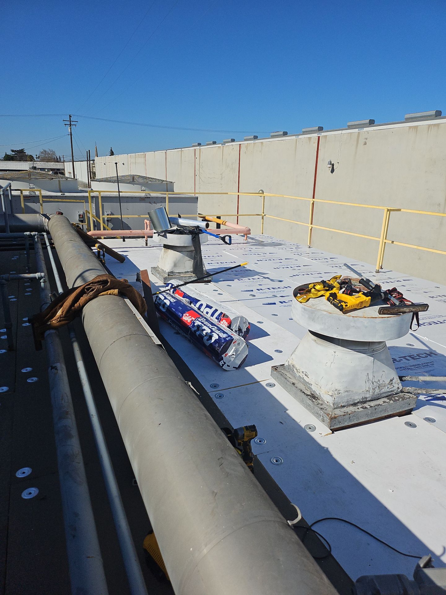 TPO single-ply roofing system using GAF Single-ply TPO 60 mil with 1.5 inch ISO board insulation by Straight Edge Roofing Inc