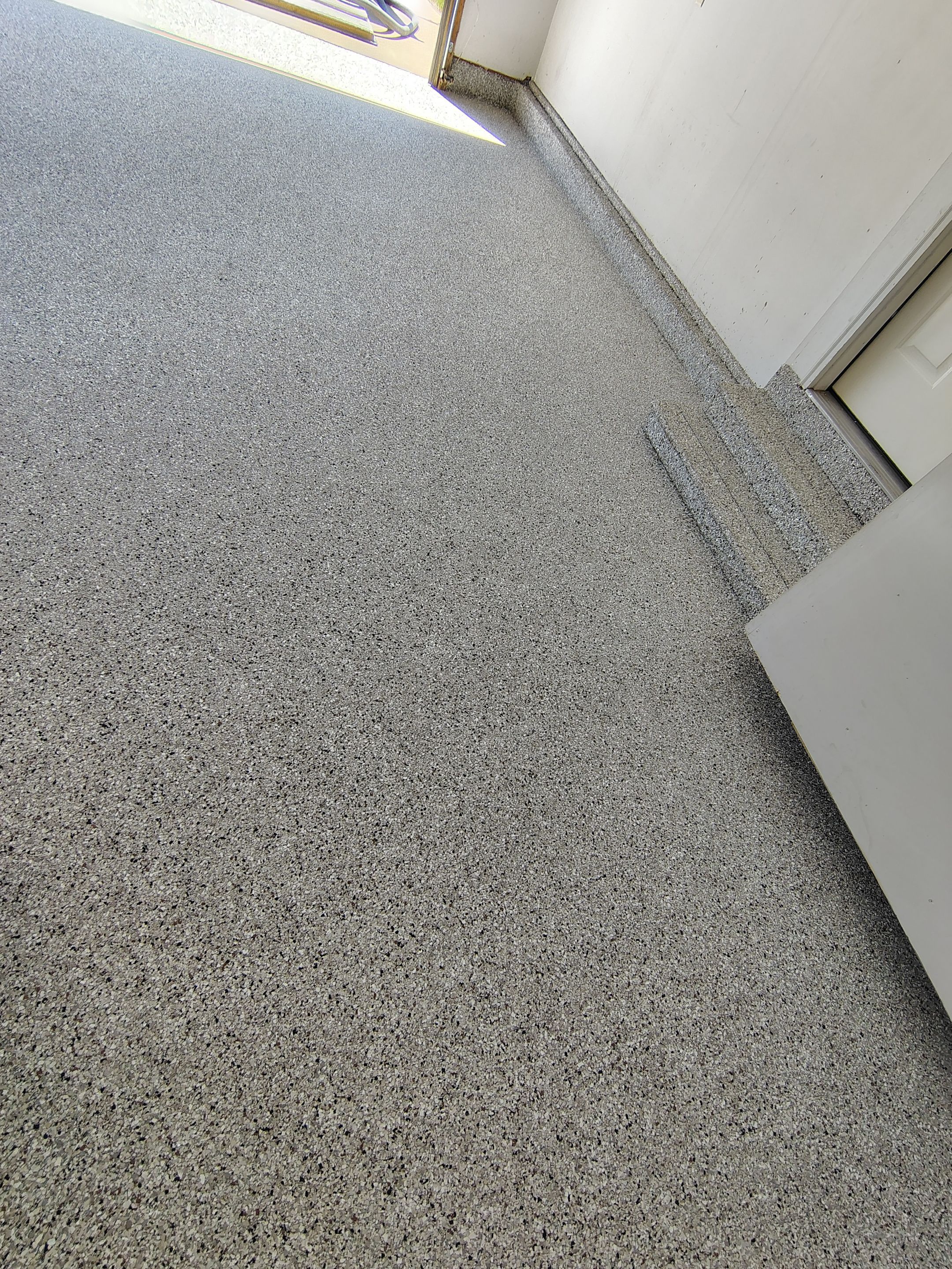 Decorative Chip Epoxy Garage Floor Coating in Sioux Falls by Select Painting, Coatings & Garage Cabinets