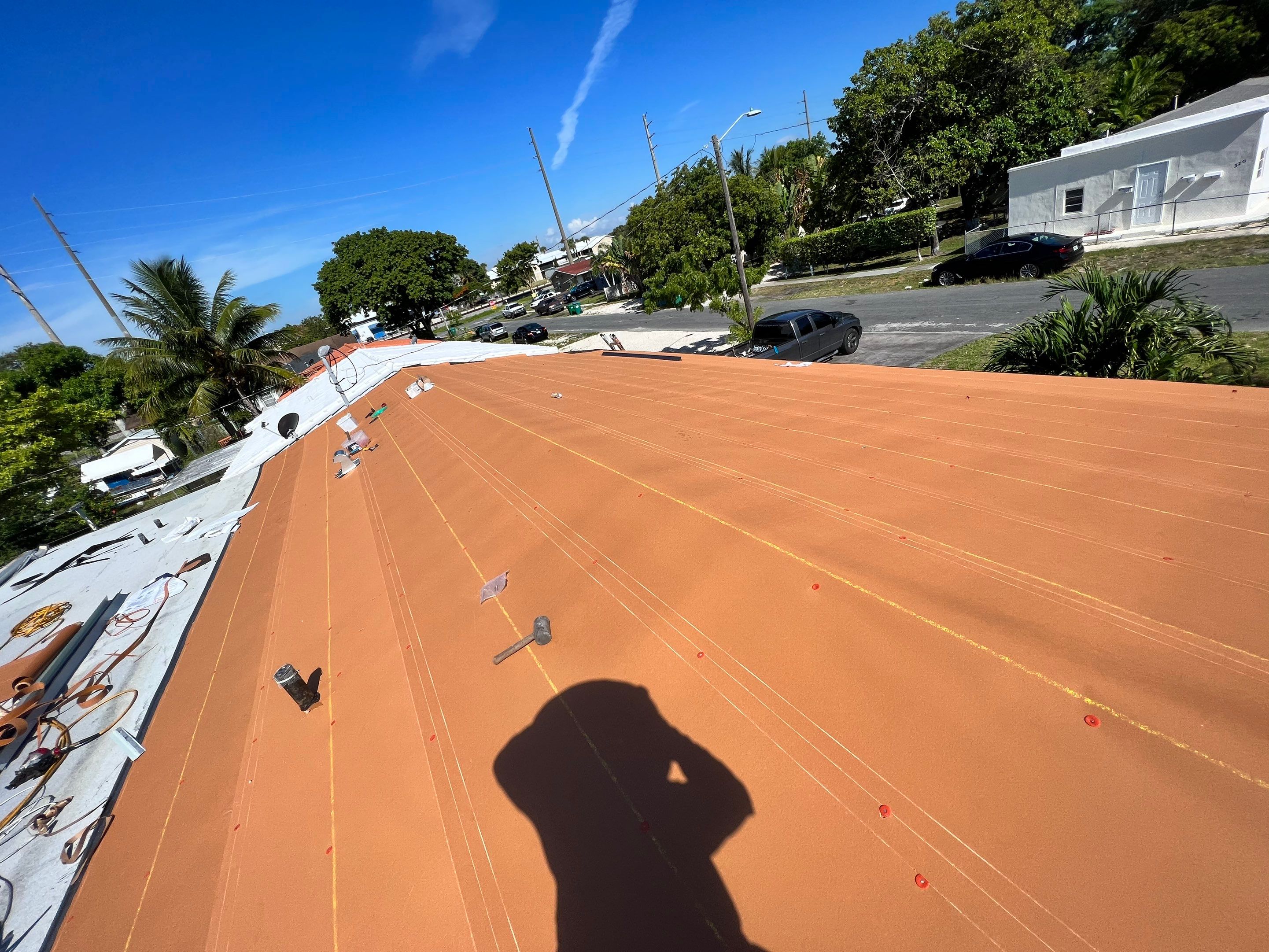 Standing Seam Metal & Flat Re-Roof using 1.5" Nail Strip 24ga Black Matte Kynar Coated Standing Seam Metal Panels by Morton Roofing, Inc.