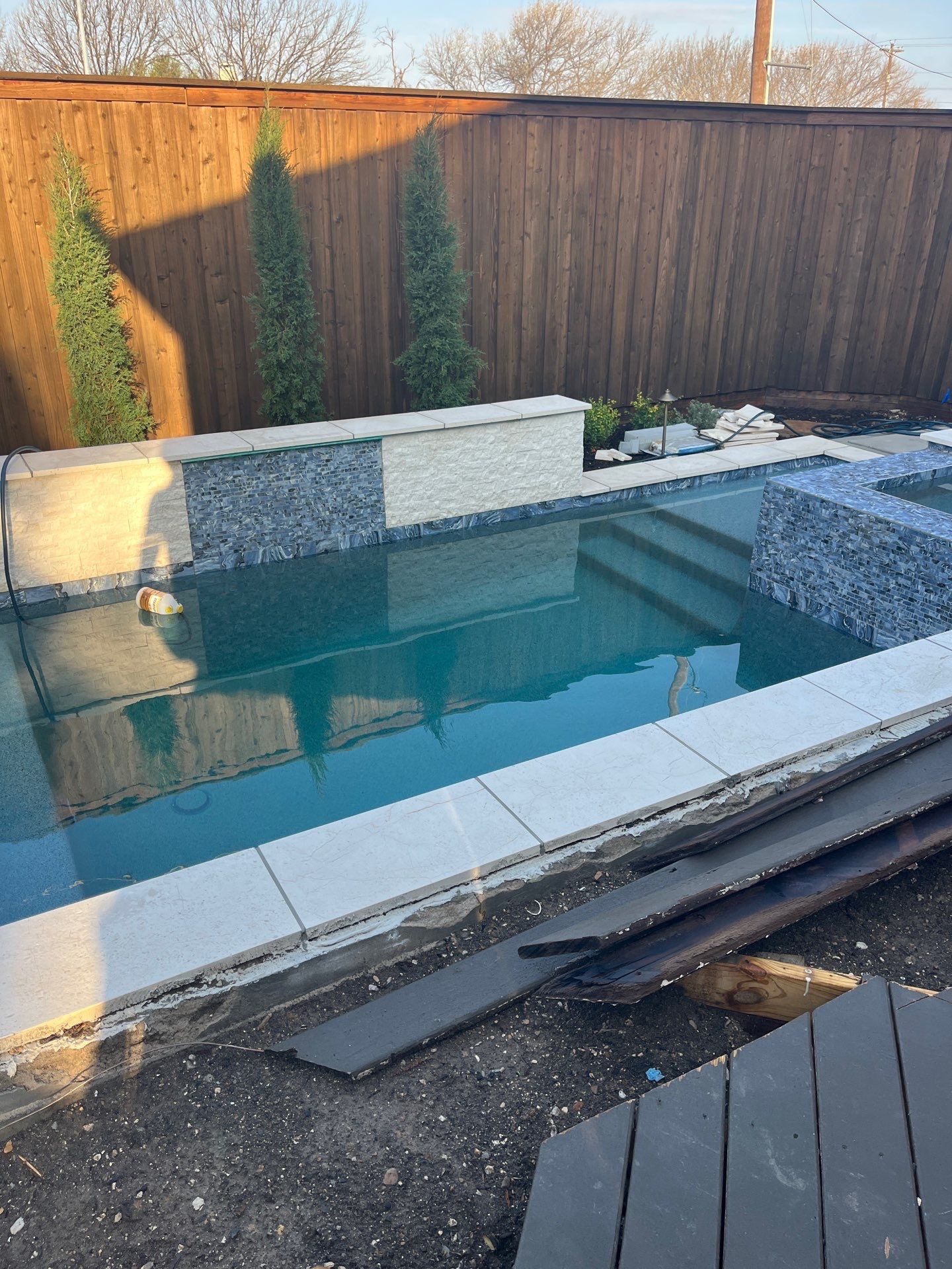 Geometric Pool and Spa with Glass Tile Walls by Pinnacle Pools and Spas - DFW