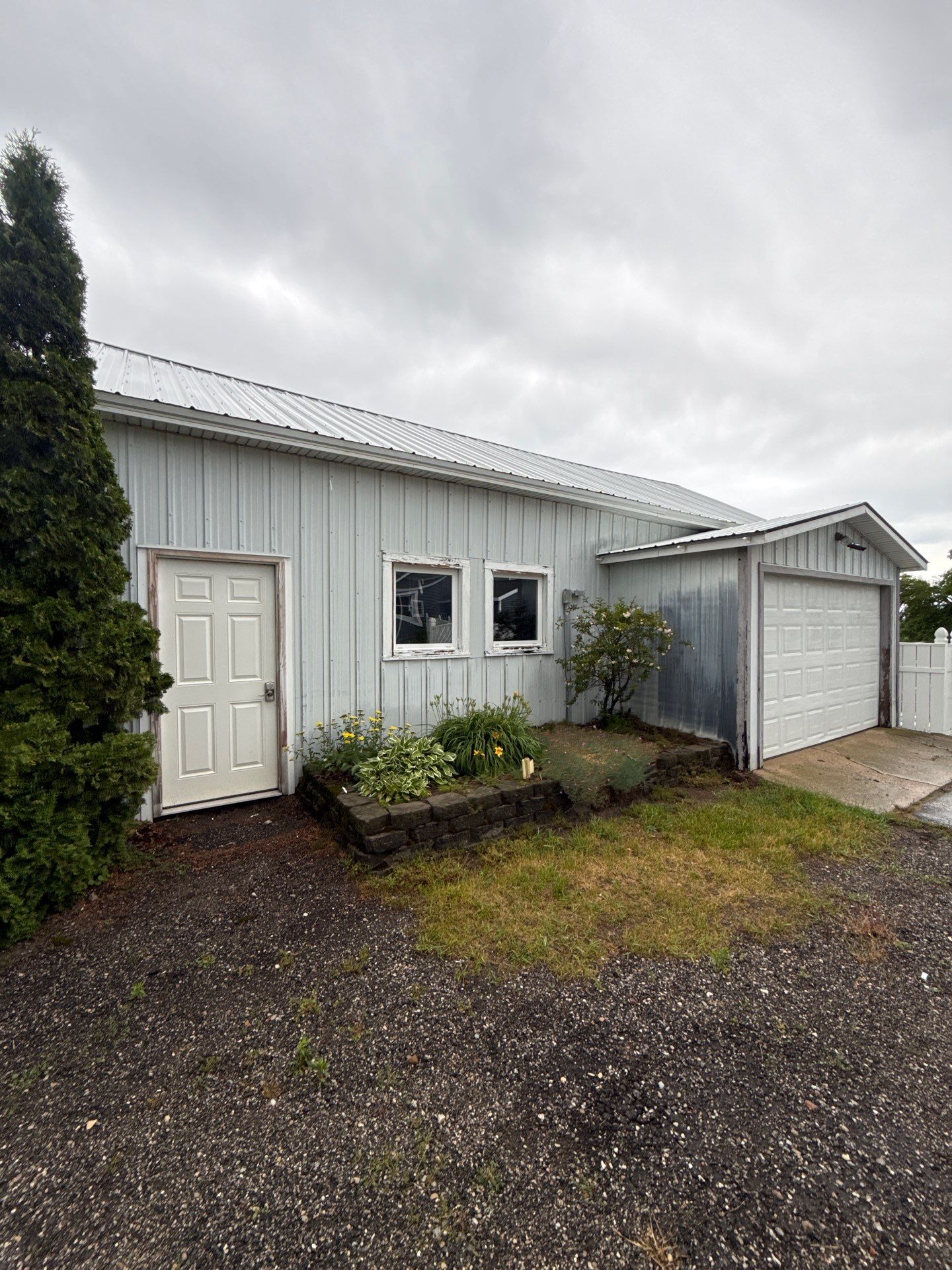 Exterior Painting and Trim Restoration for Mears Metal Buildings by Gordon Painting