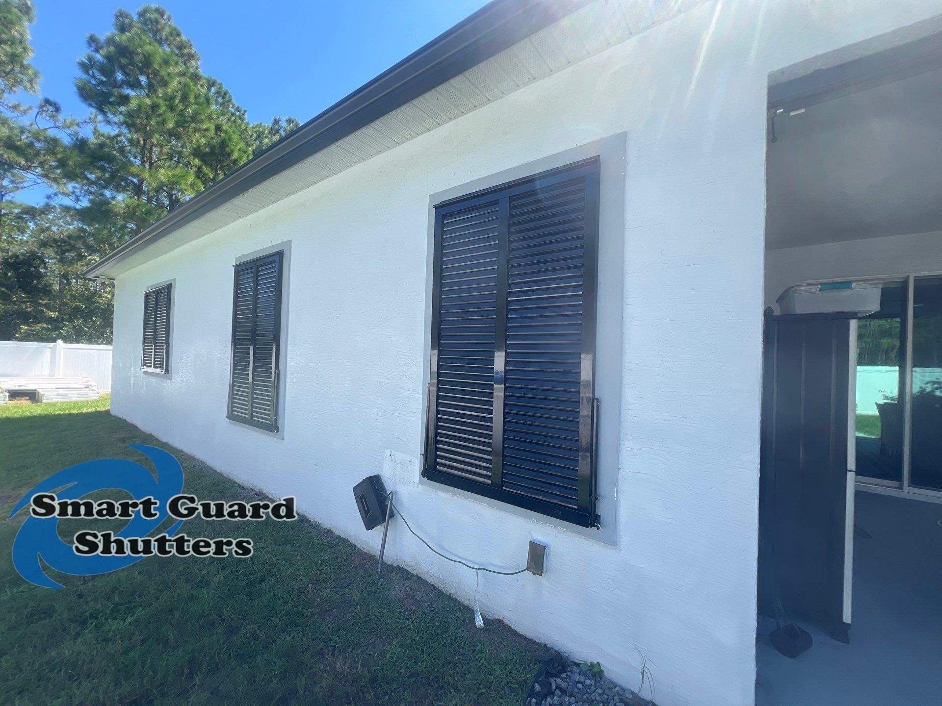 Impact Bahama Shutters in Jet Black by Smart Guard Shutters
