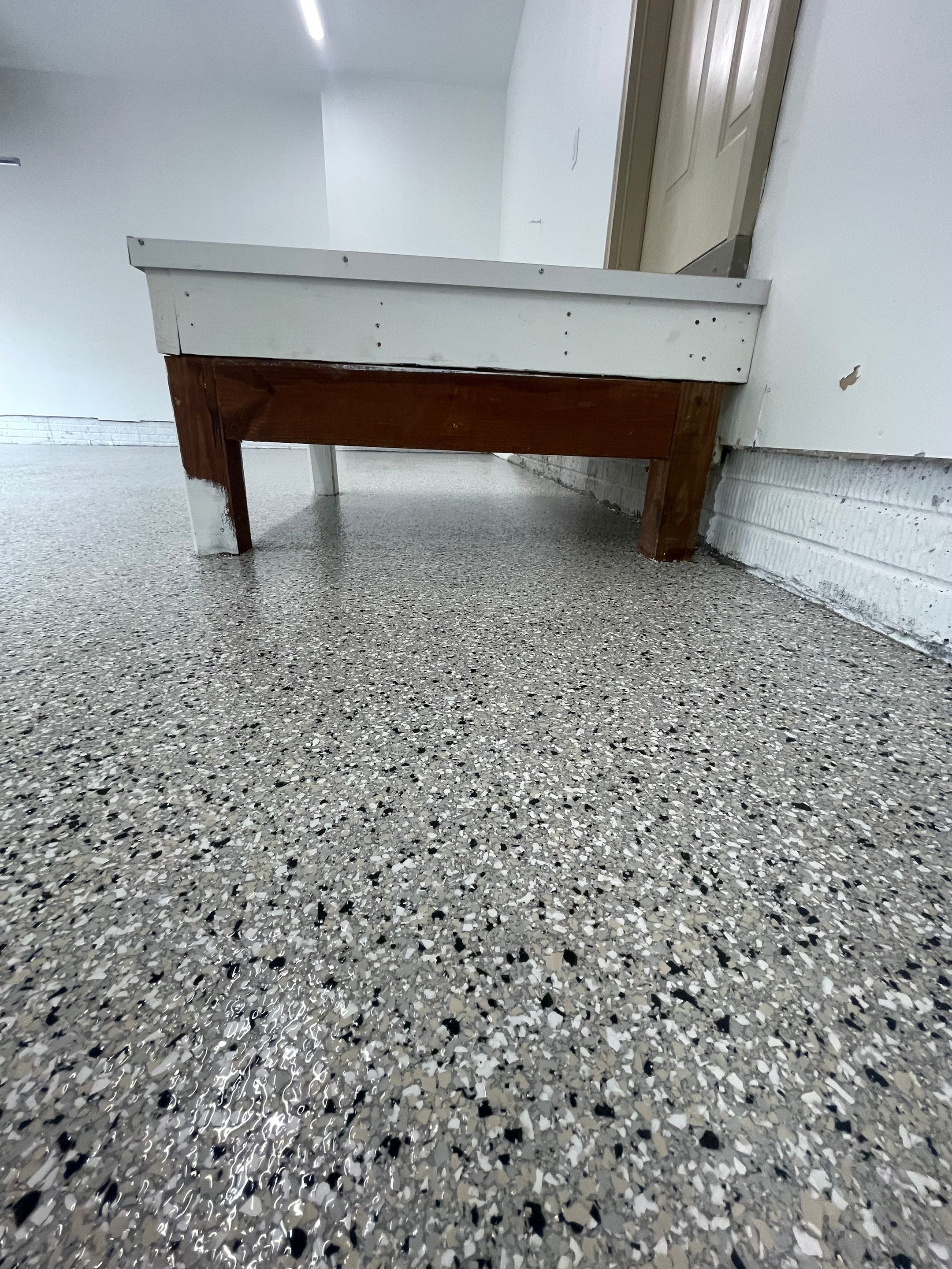Cabin Fever Garage Floor System in Sioux Falls by Select Painting, Coatings & Garage Cabinets