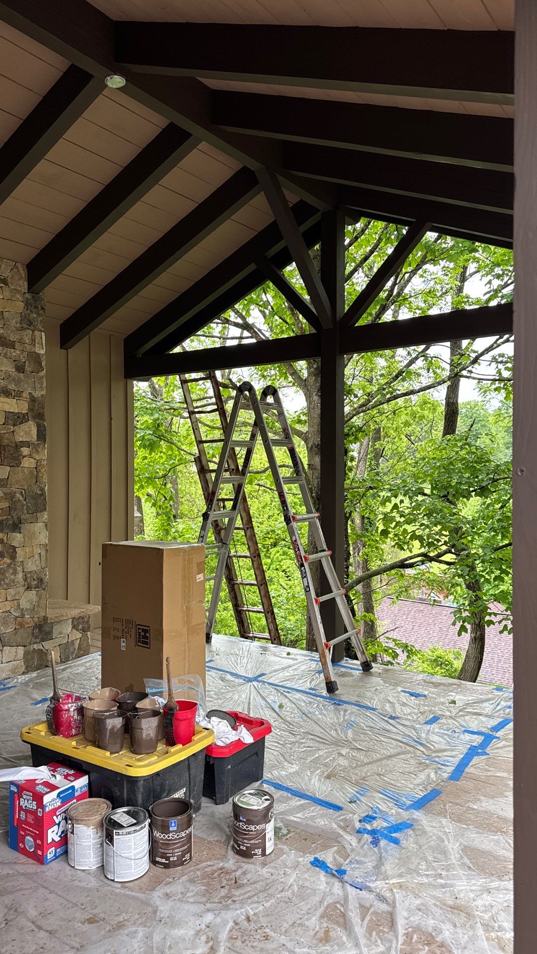 Custom Composite Deck with Stone Fireplace and Modern Cable Railing by Walnut Hollow Decks & Outdoor Living