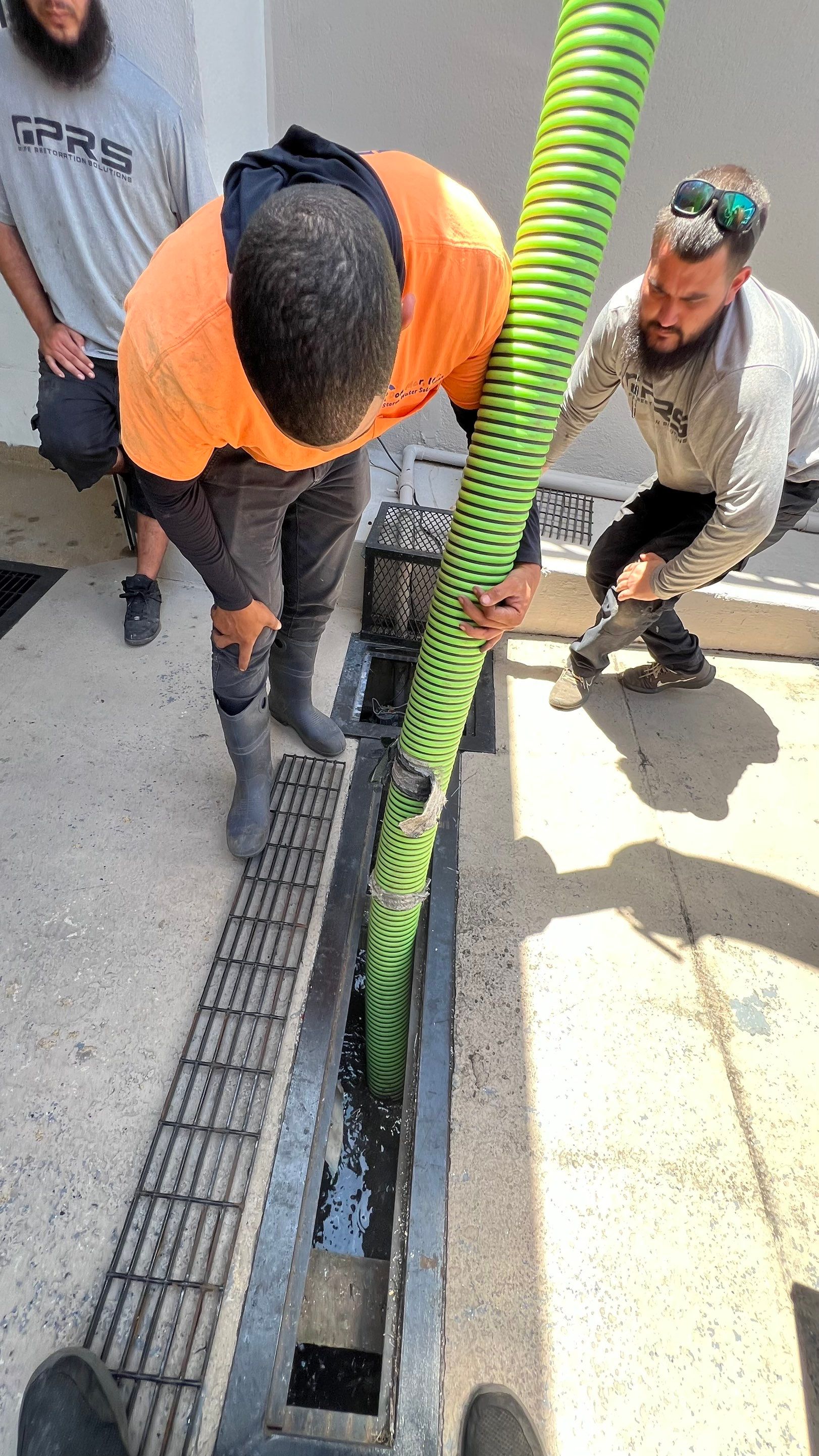 Condo Channel Drain and Sump Pit Cleaning by APS Power & Water