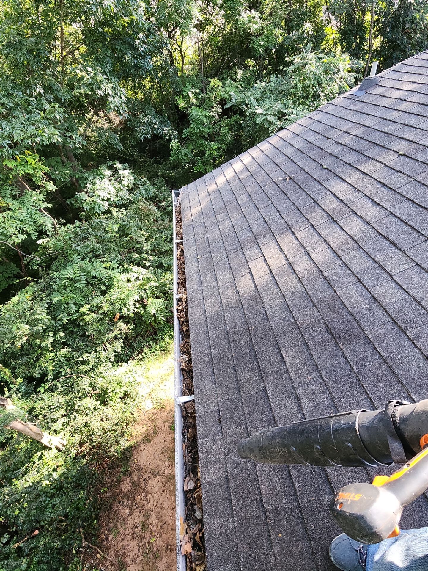Commercial gutter cleaning Lynchburg, VA before photo with filled gutters