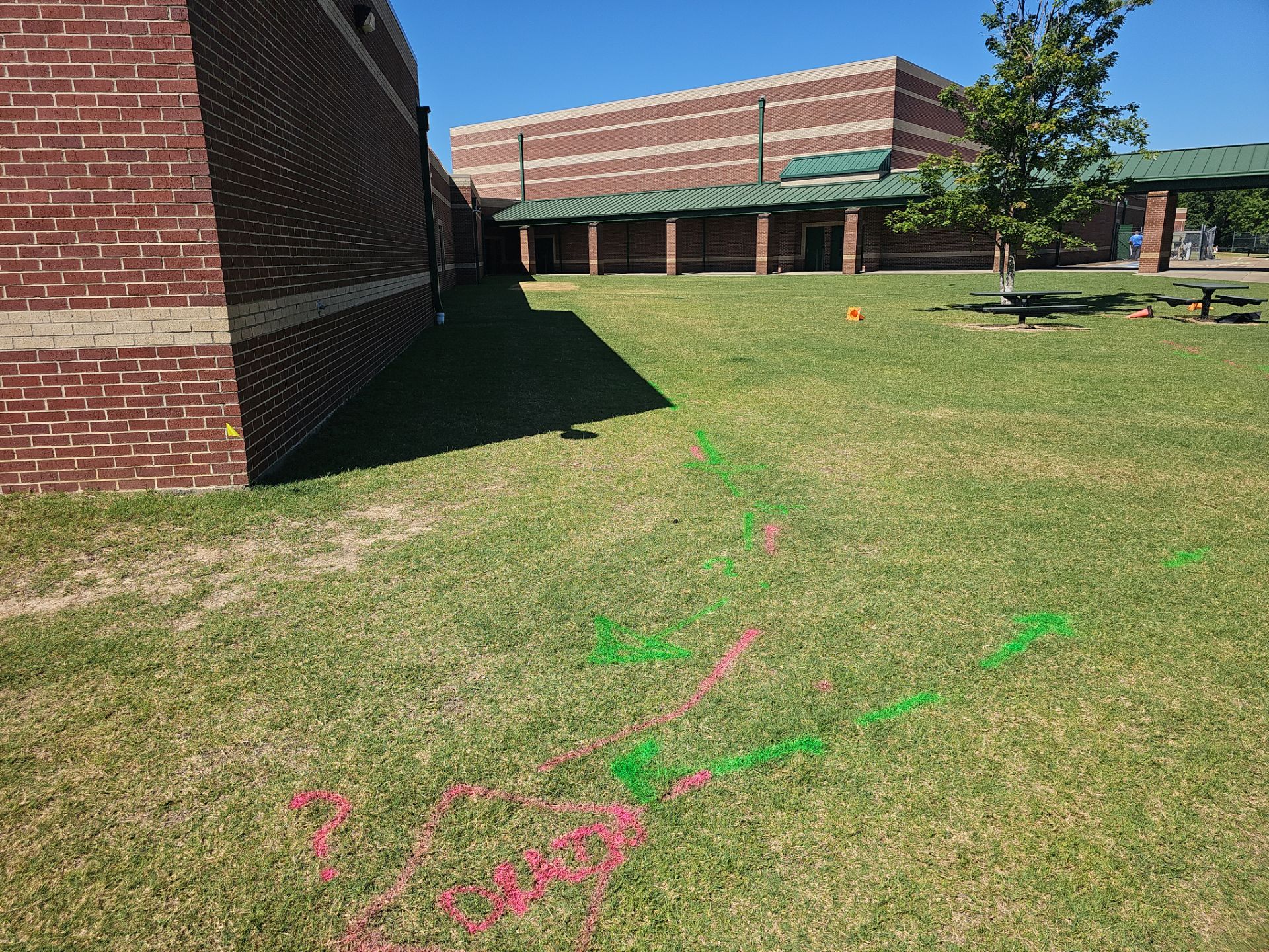Utility Locating at a school for fence install by Alsip Locating Service, LLC