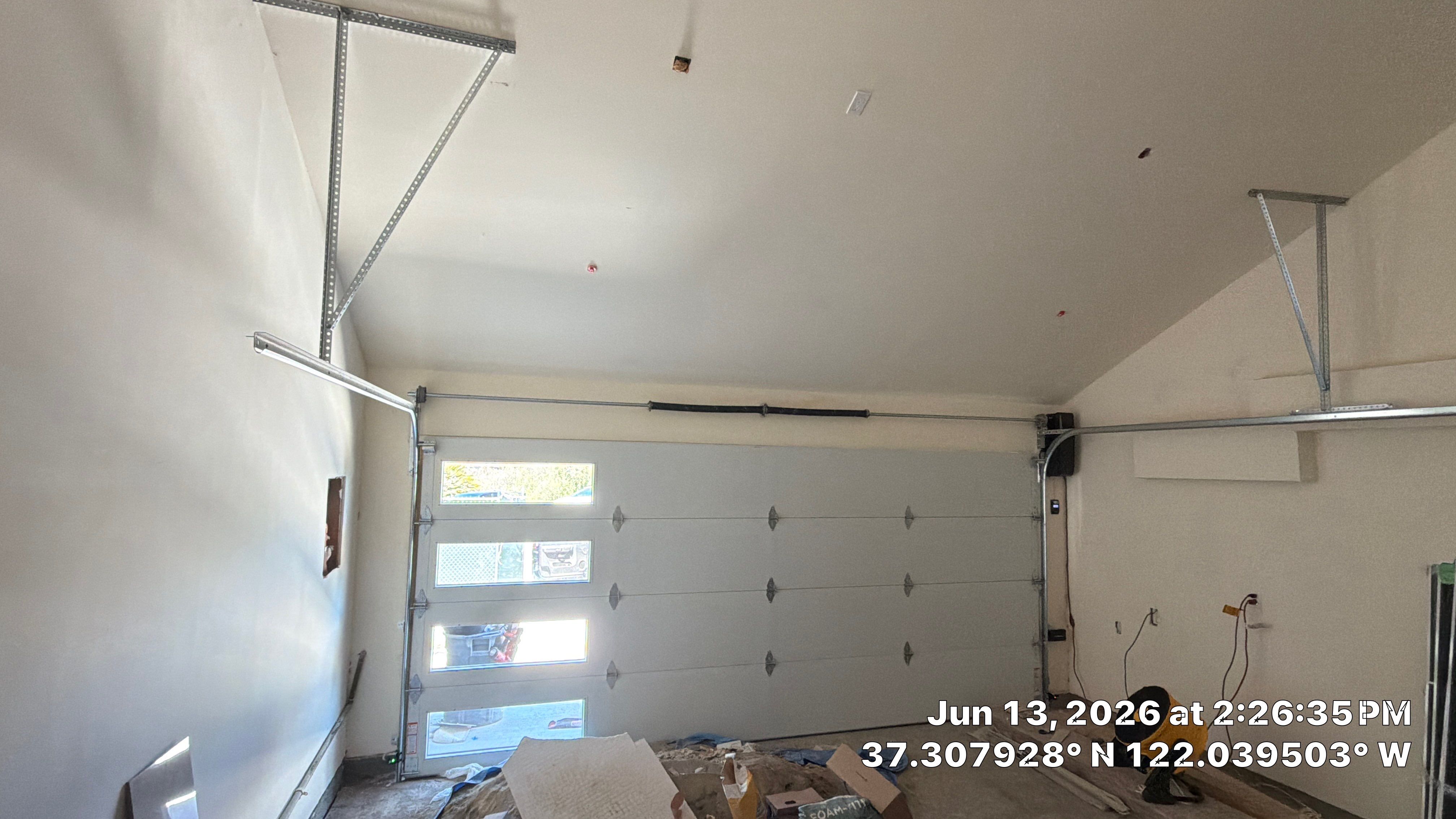 Modern Black Garage Door Installation With Vertical Windows In Cupertino by Valiant Garage Door