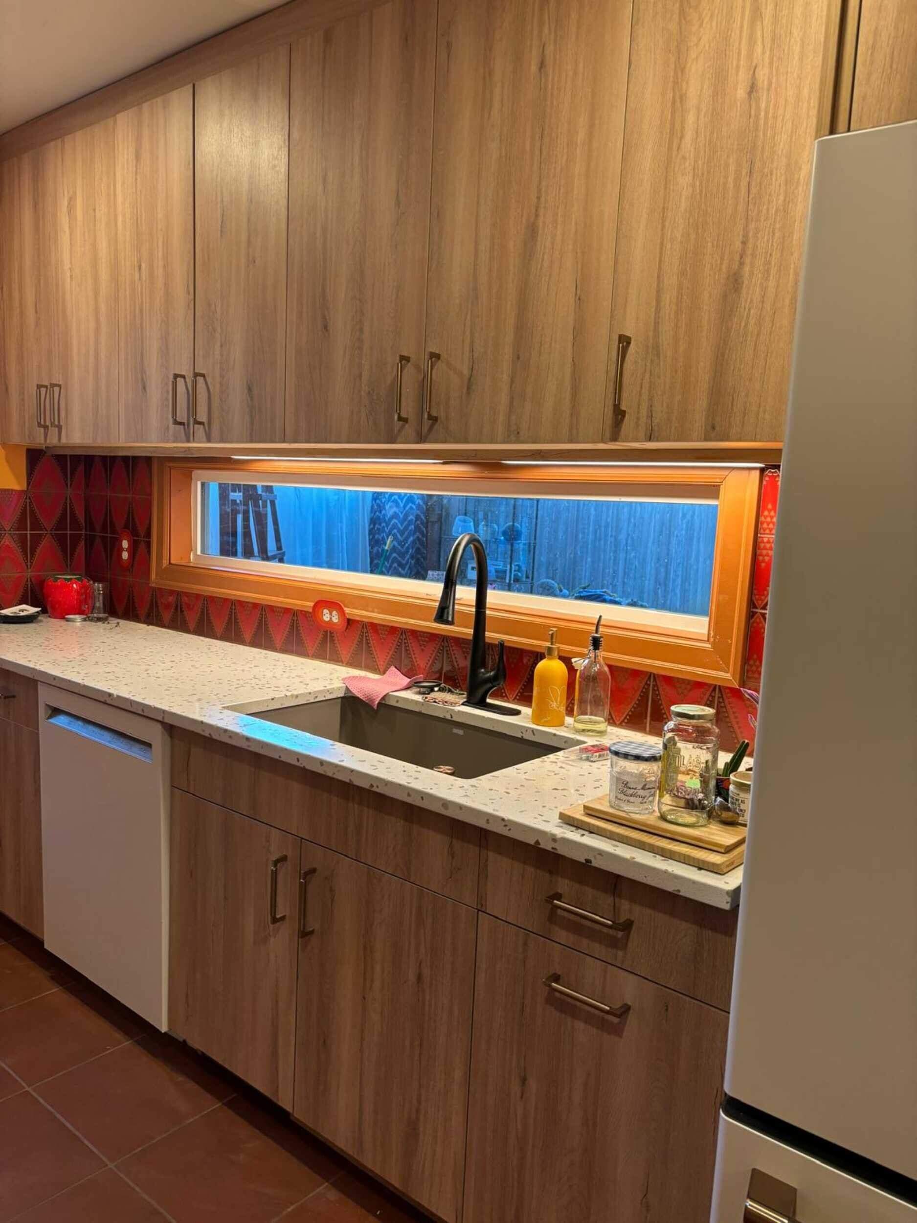 Complete Kitchen Remodeling Featuring Terracotta Tile and Wood Cabinetry by American Made Construction 