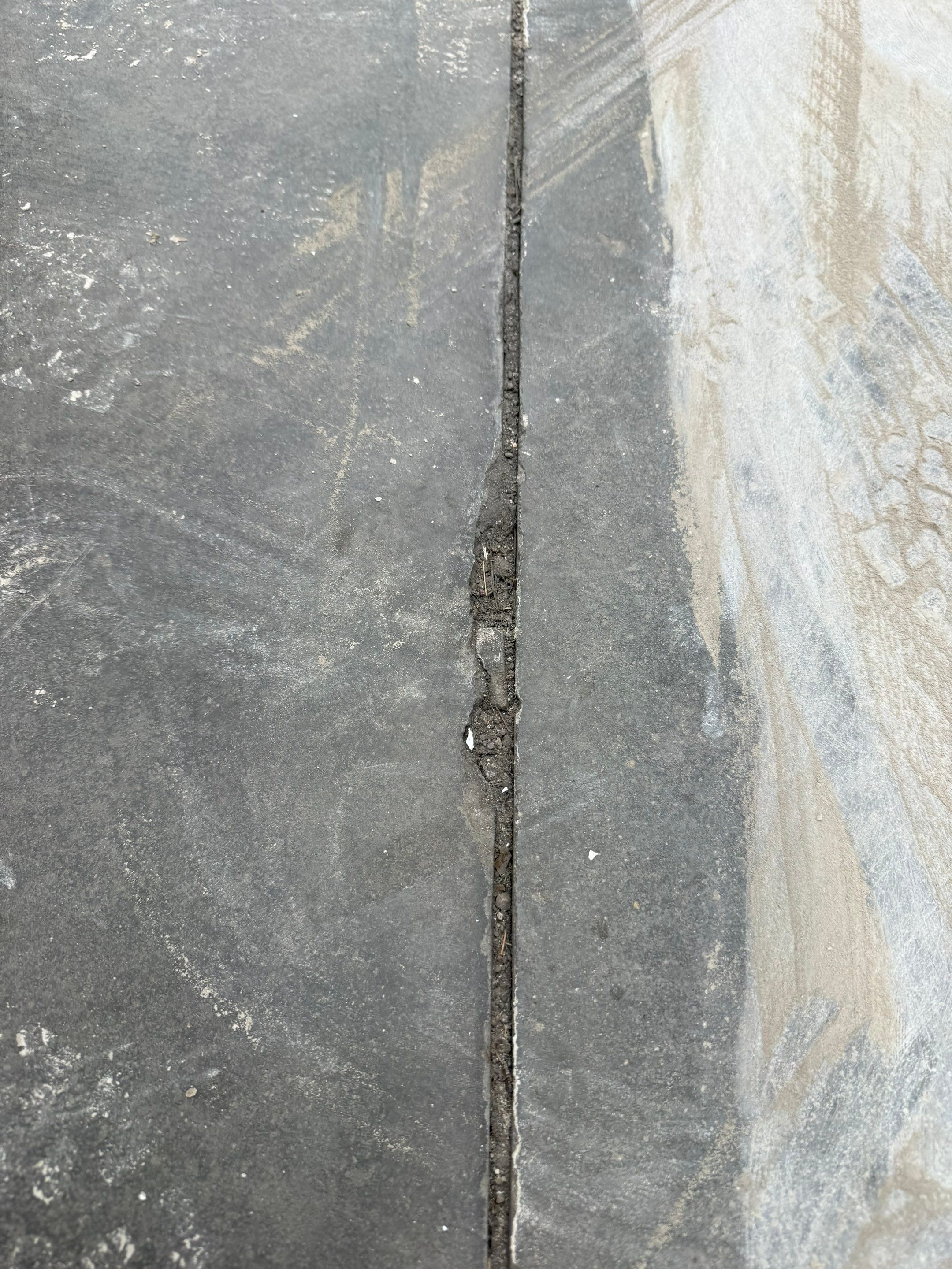Feather Gray Epoxy Floor Coating Installation in Sioux Falls by Select Painting, Coatings & Garage Cabinets
