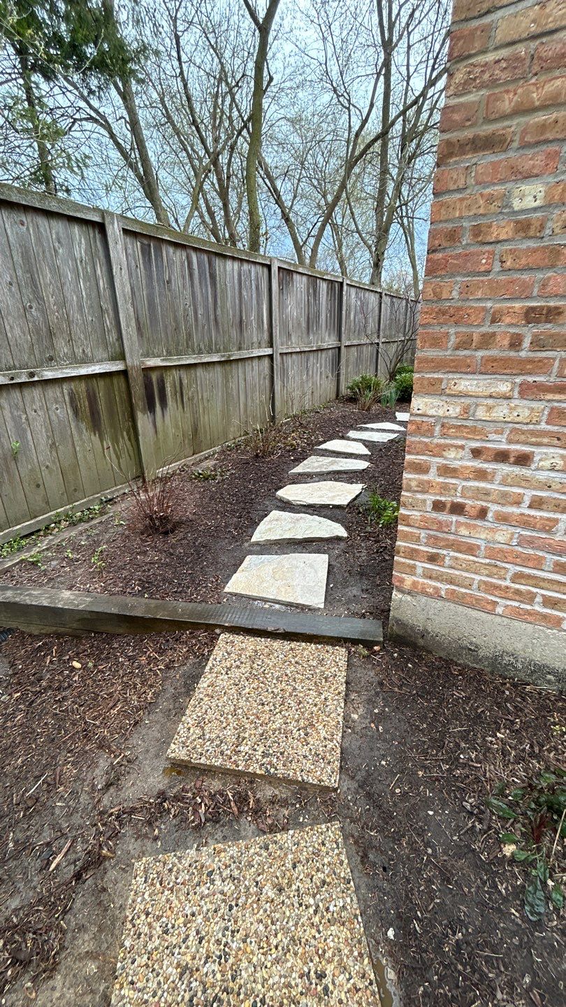Flagstone stepper cleaning by Northern Power Washing LLC.