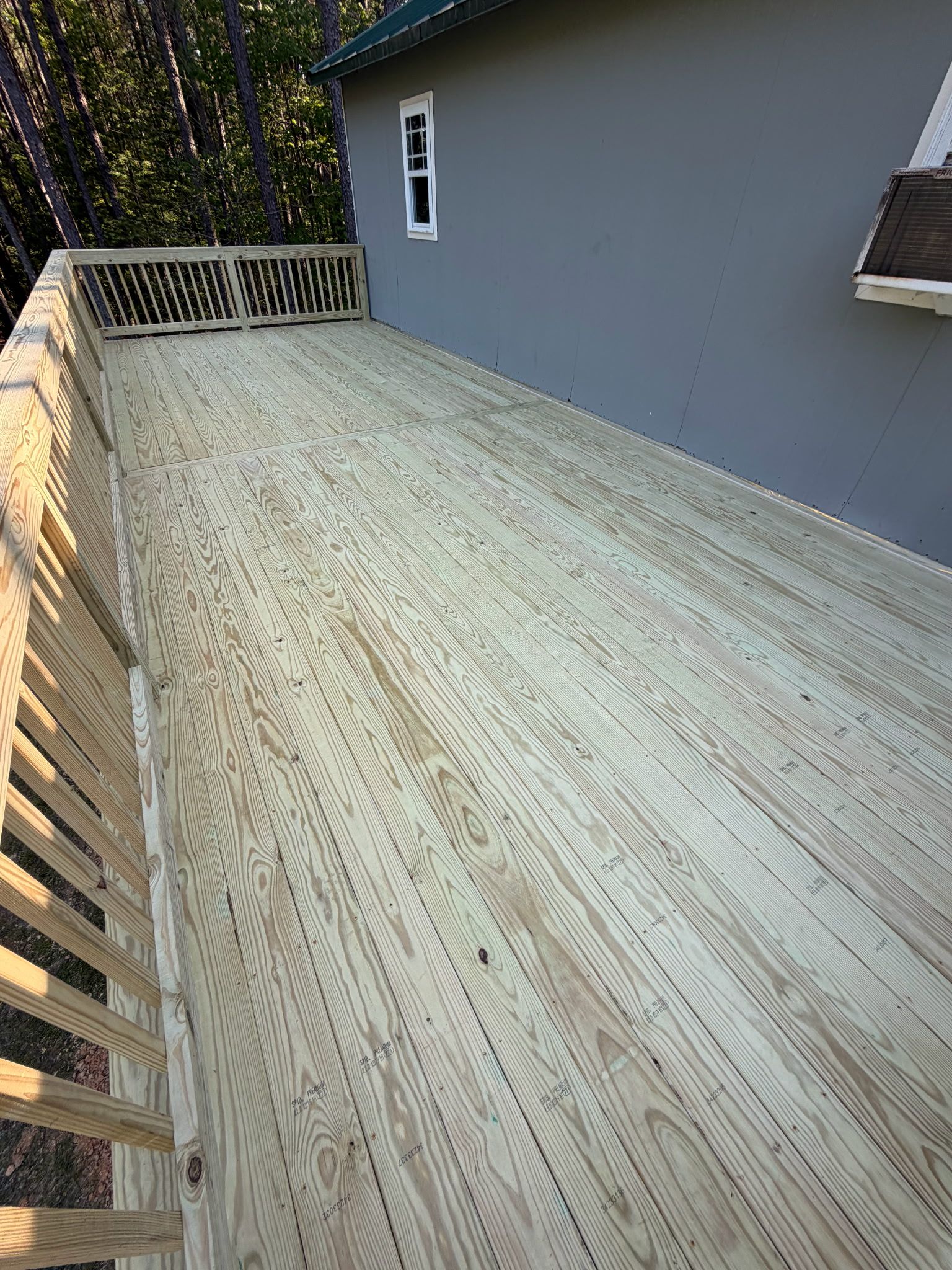 Pittsboro Outdoor Living Transformation – Retaining Wall, Paver Patio & Elevated Deck by Elite Remodeling and Design LLC