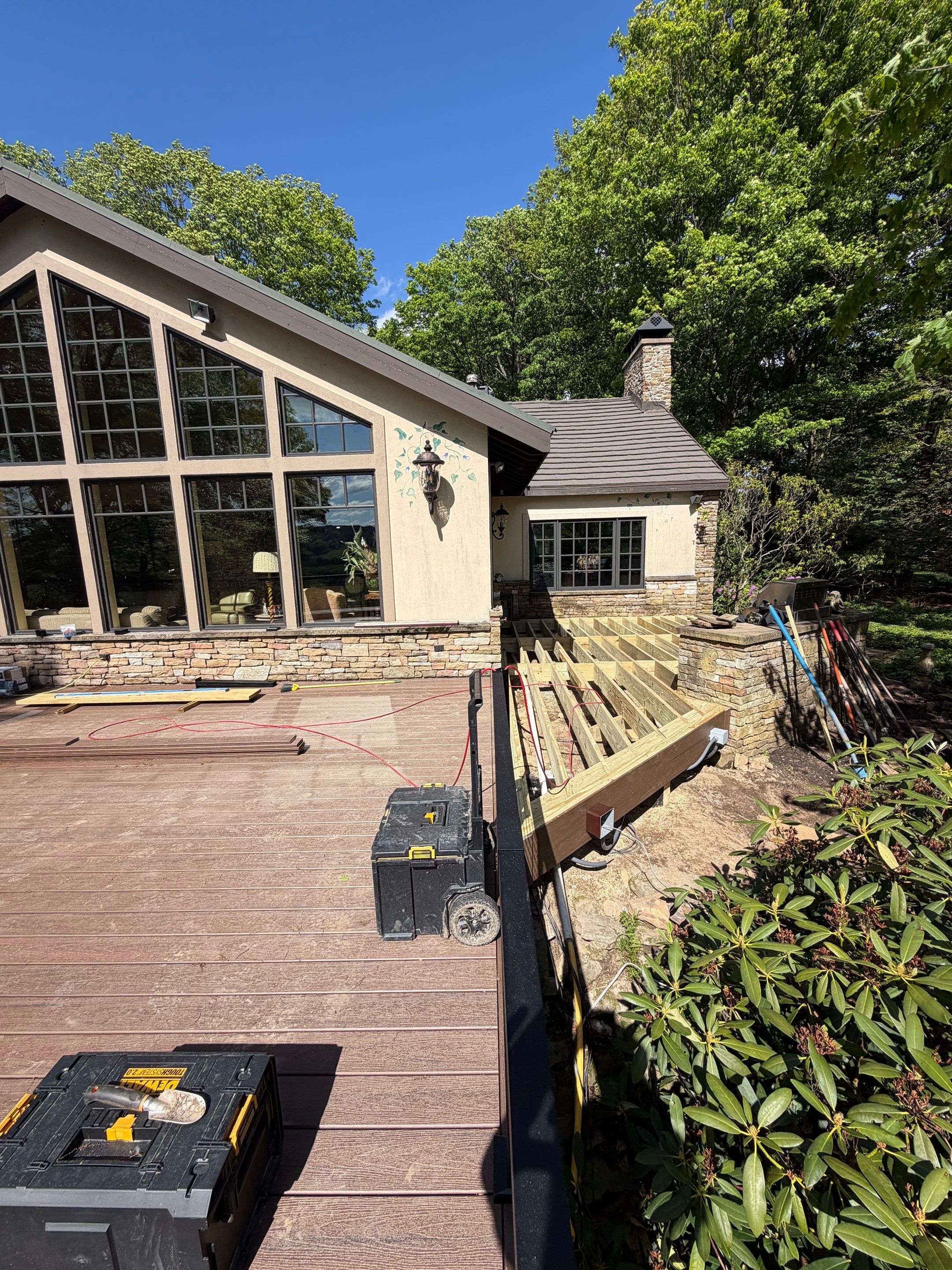 1500 sq/ft Composite Deck Build with Outdoor Kitchen in Champion by Cousins Roofing Siding & Decks