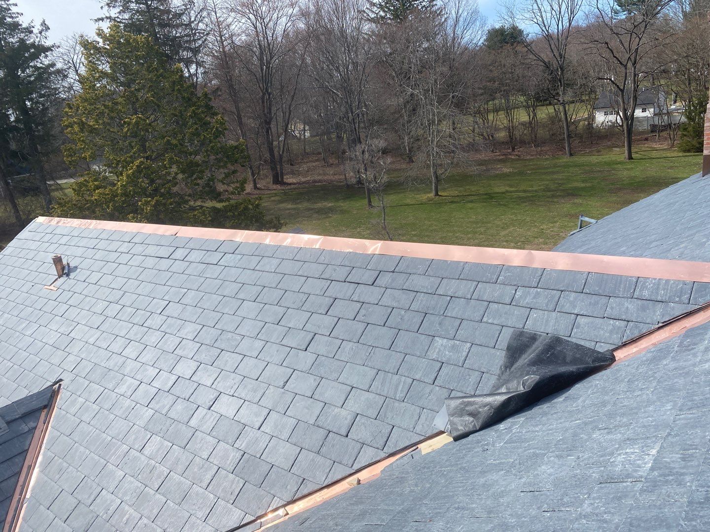 Residential Roofing Installation using Vermont Slate by A Plus Exterior