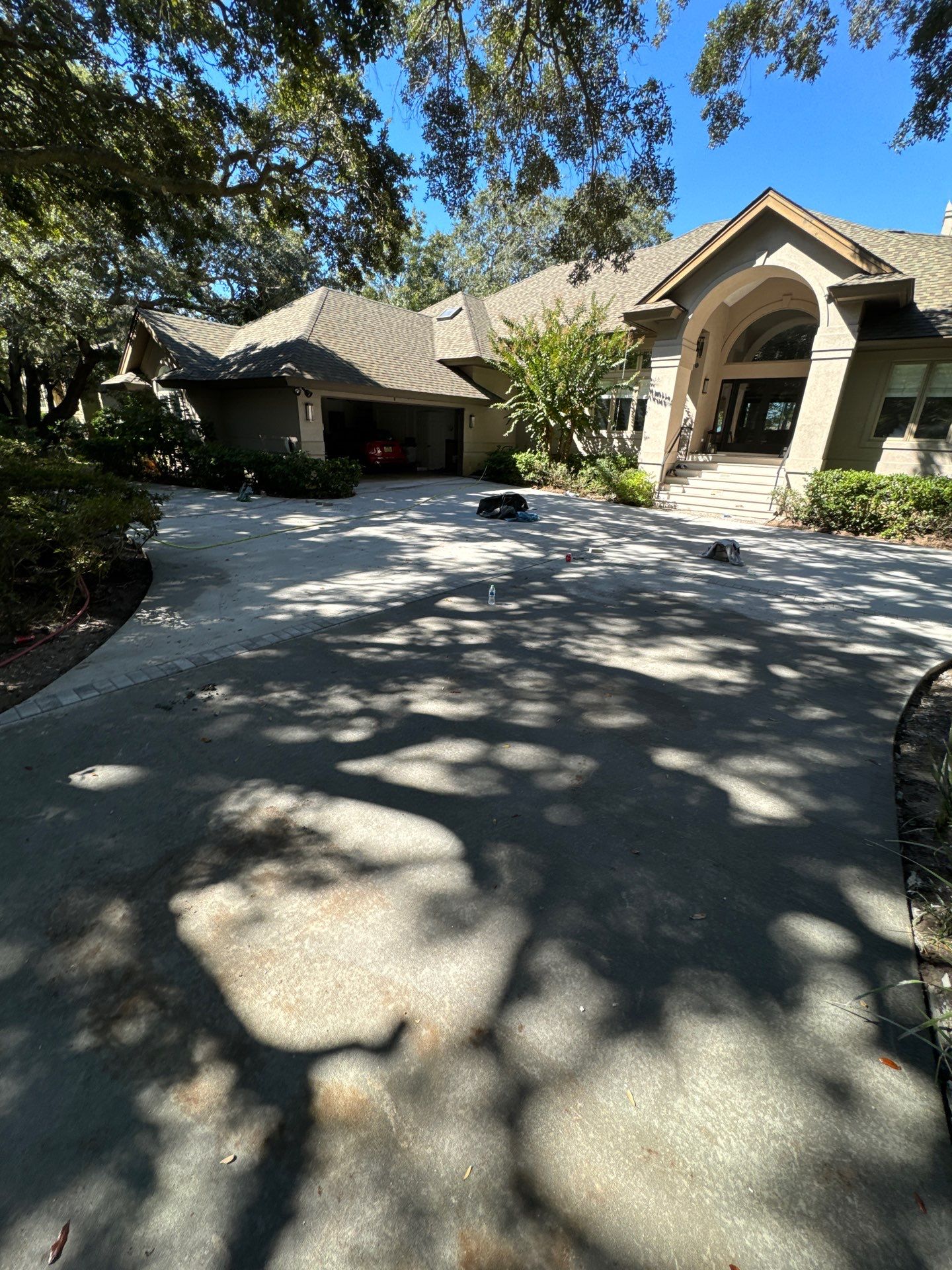Custom Concrete Driveway with Decorative Paver Inlays in Hilton Head Island by Lowcountry Scapes, LLC