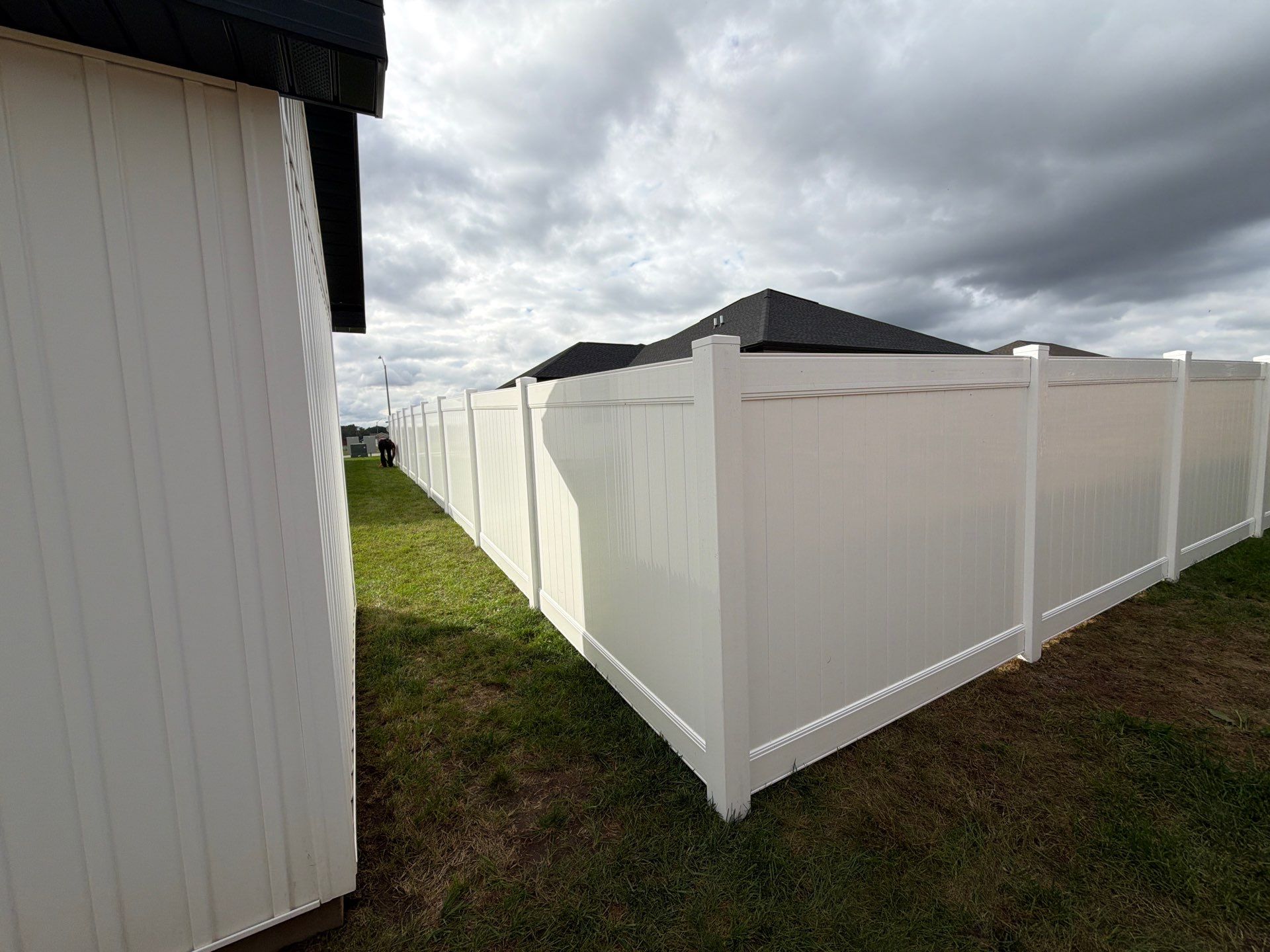 Residential White Vinyl Privacy Fence Installation in Janesville by Perfect Picket Fence and Stain