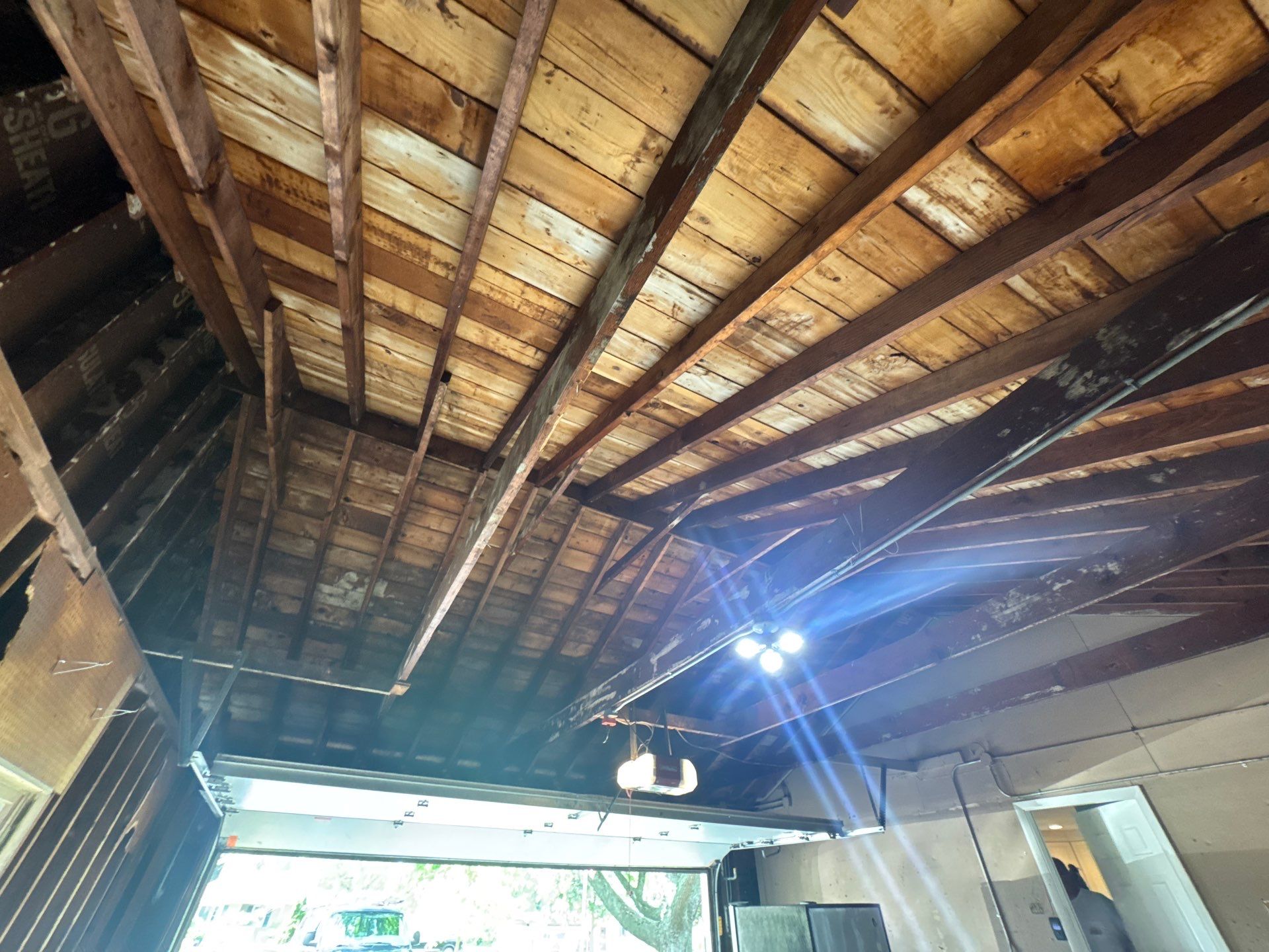 Bayside Garage Interior Remodel with Custom Epoxy Floor Coating by OCS Contracting Services