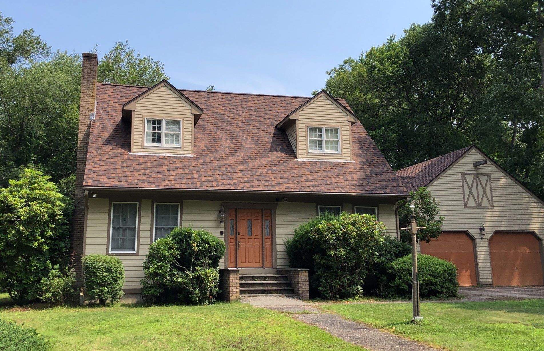Burnt Sienna Roofs by Pinnacle Roofing & Skylights