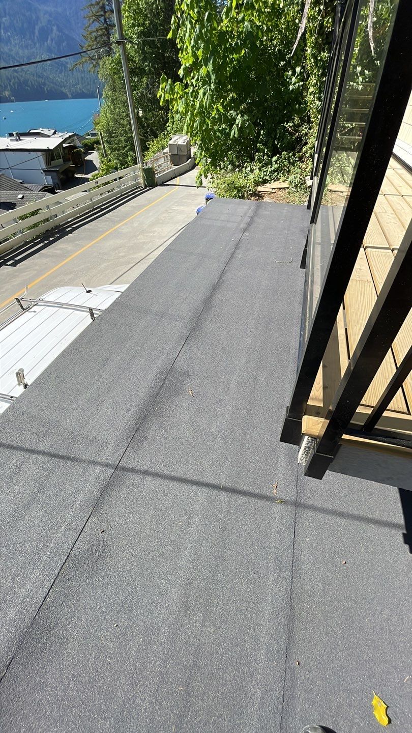 Small patio roof with 2ply sbs  by Top Notch Roofing Inc