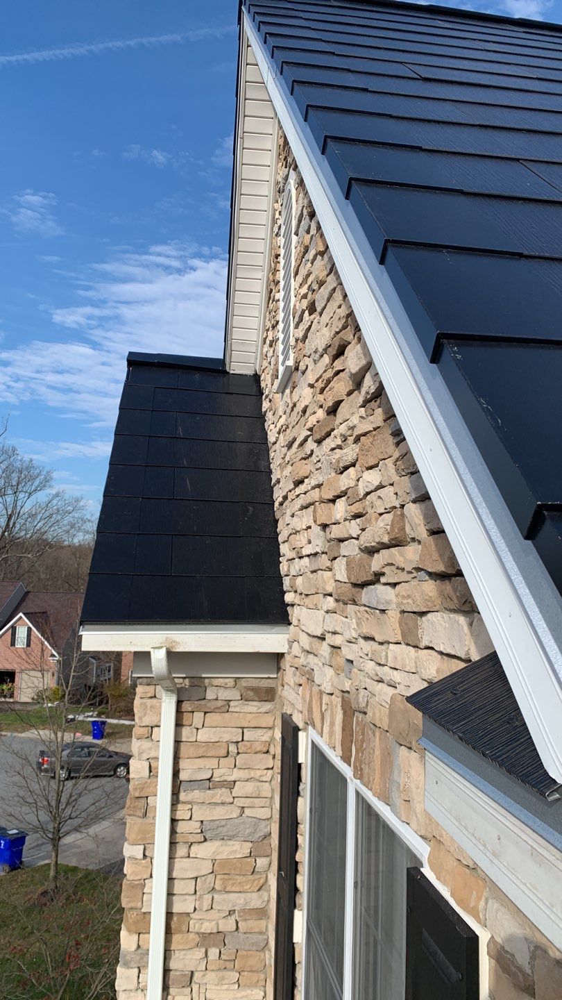 Tesla Solar Roof and Gutter Installation by American Home Contractors