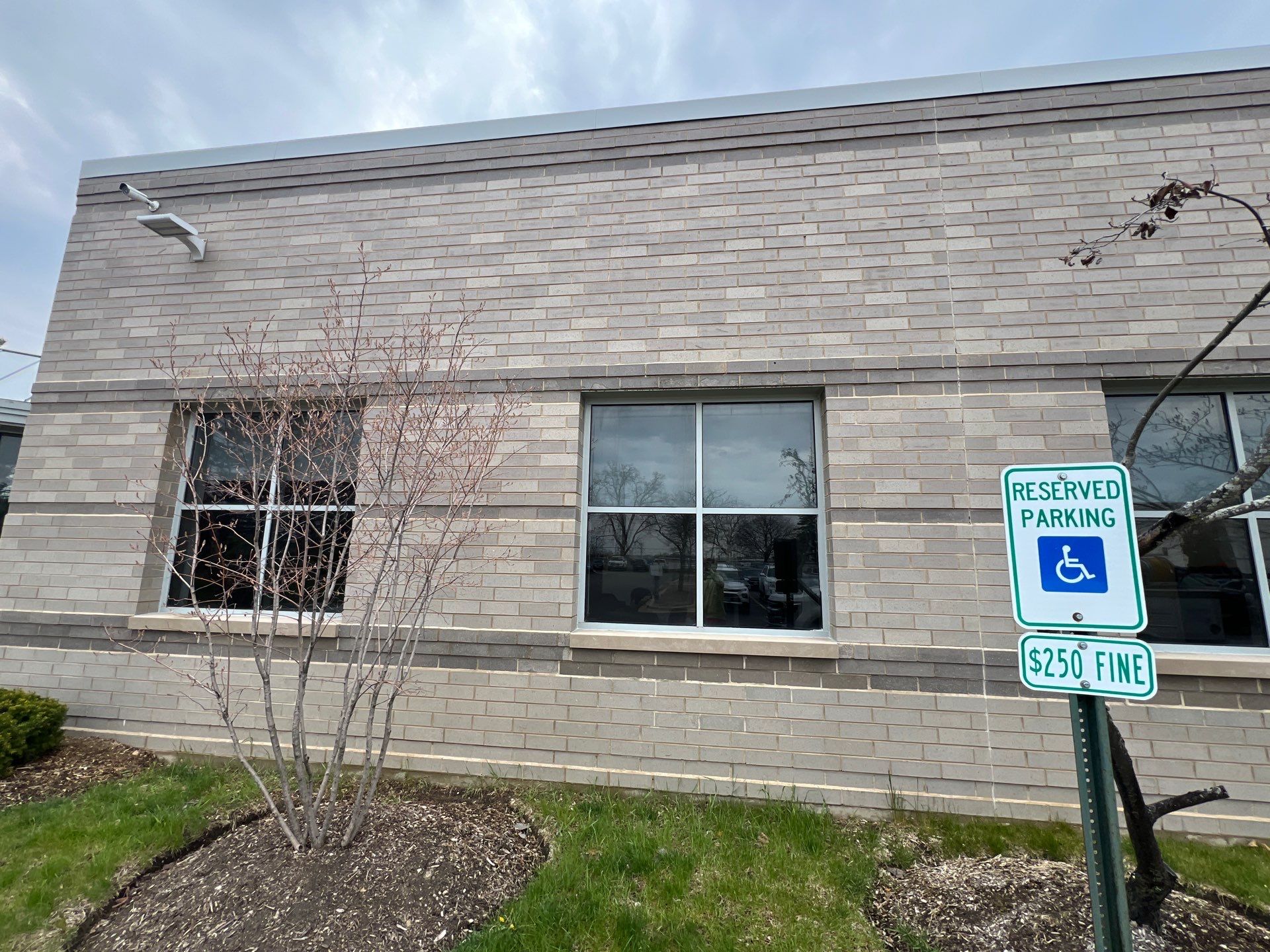 Commercial Facade cleaning using Algaecide, soft wash soap by Northern Power Washing LLC.