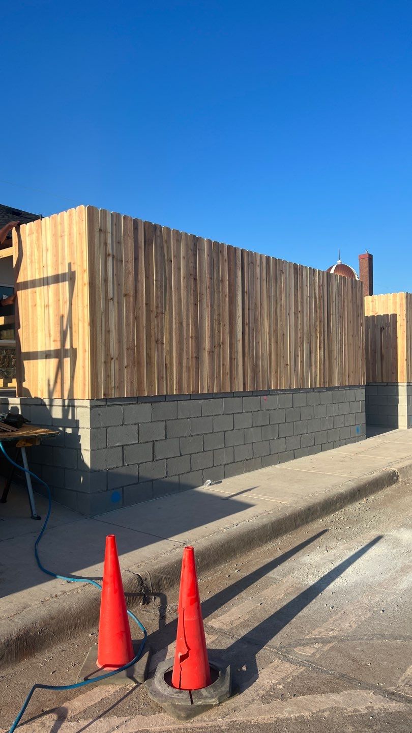 Cedar Fence using Cedar Pickets and Metal Poles by Clays Services Inc