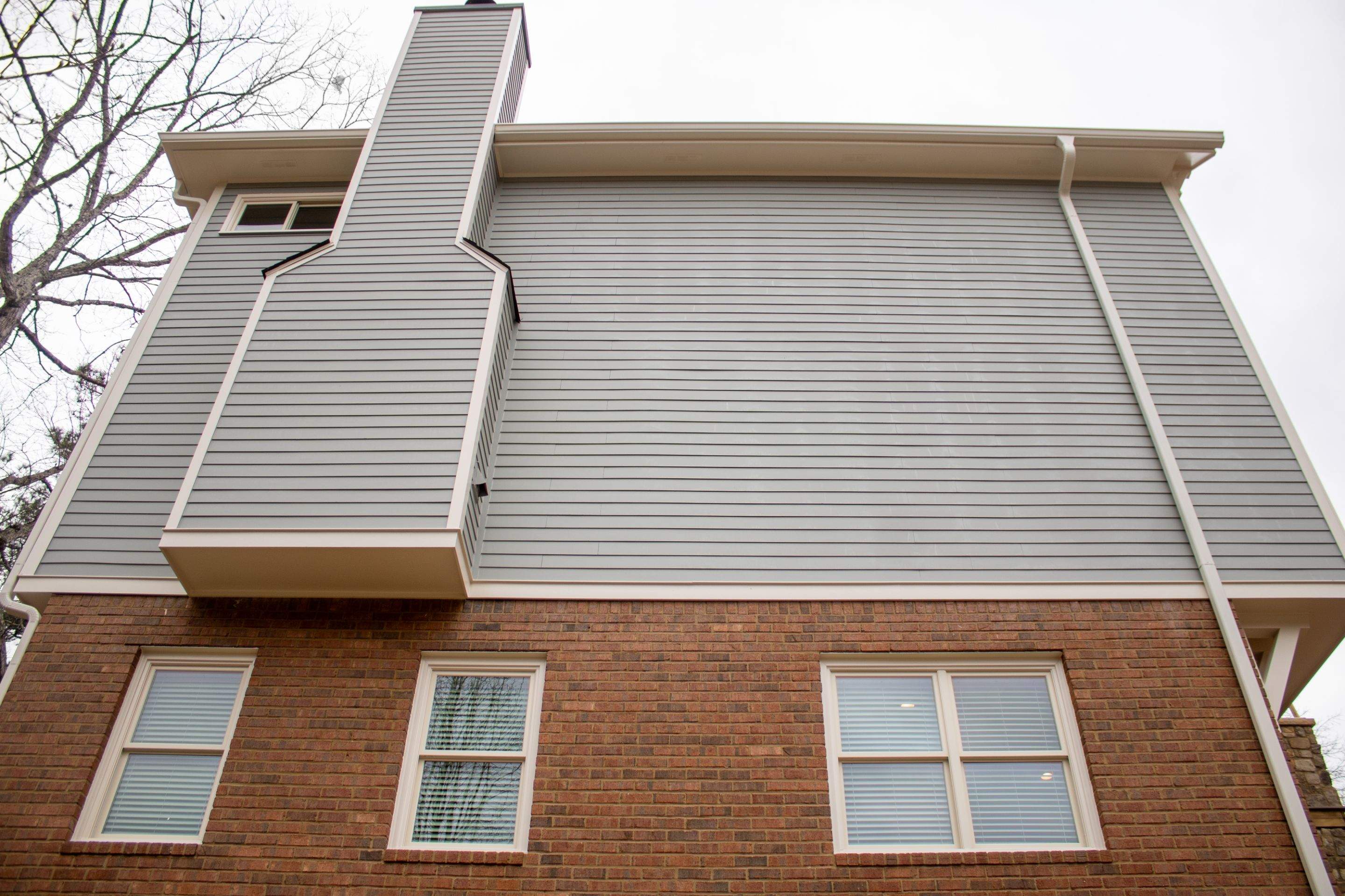 James Hardie Siding Replacement, Exterior Painting, Deck Stain, and Gutter Installation in Peachtree Corners, GA by Nelson Exteriors