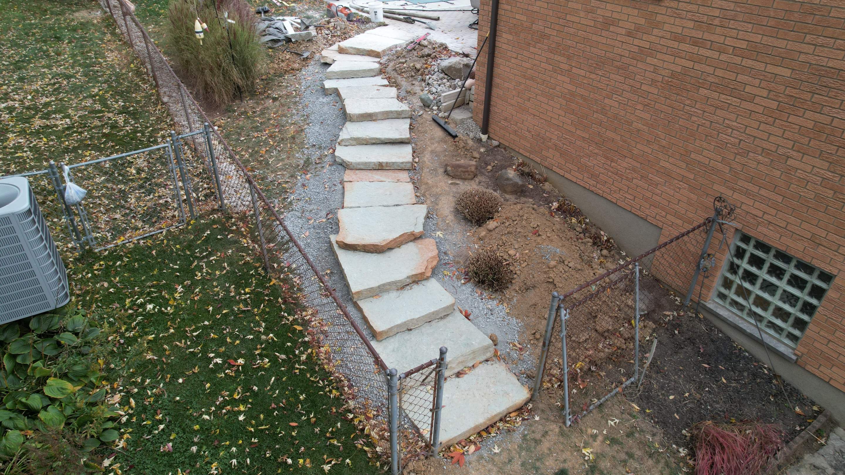 Rustic Buff Tread Stairway Installation by Reisenberg’s Lawn & Landscape, LLC