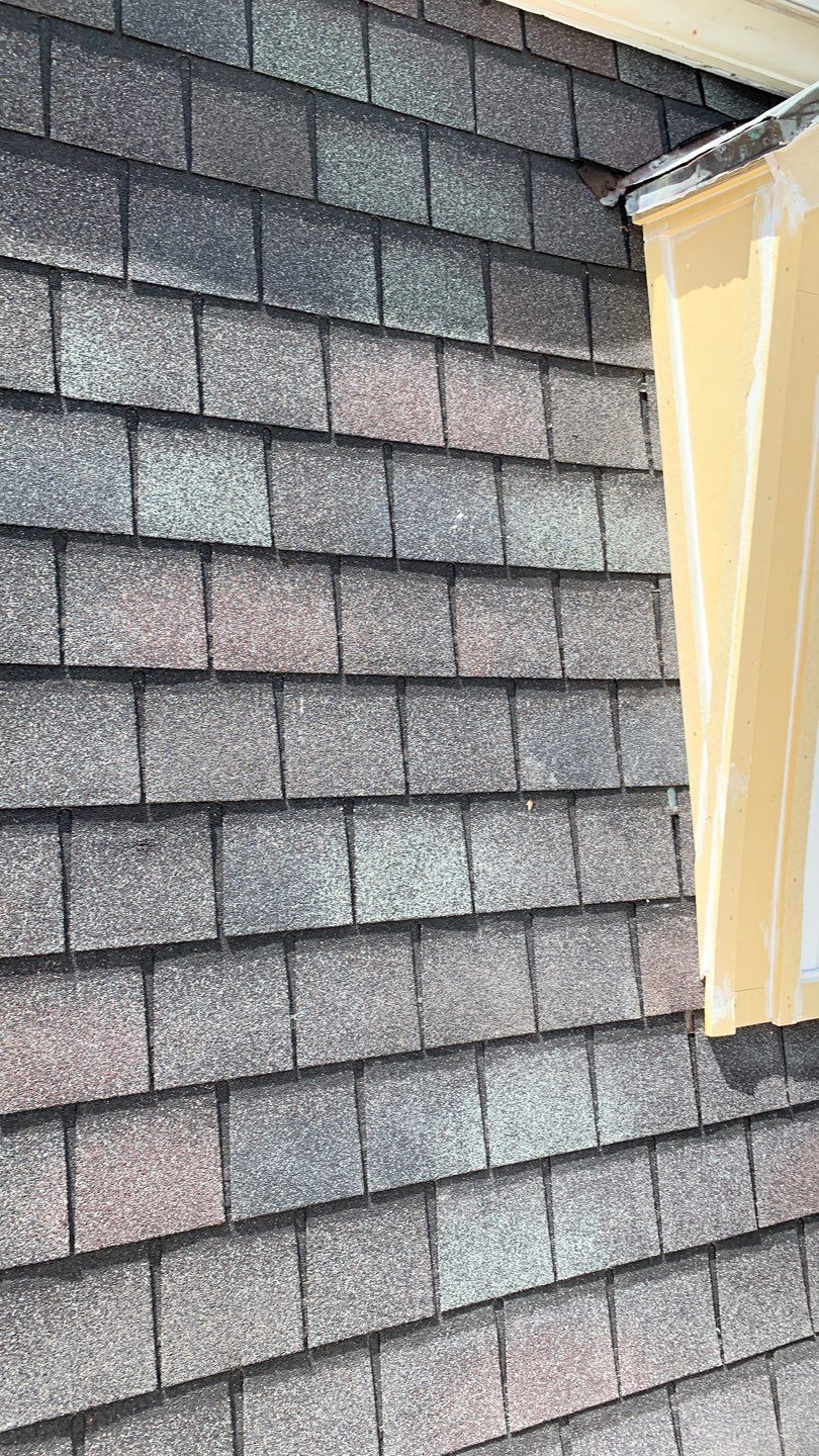 Mansard Charm by Bayfront Roofing and Construction