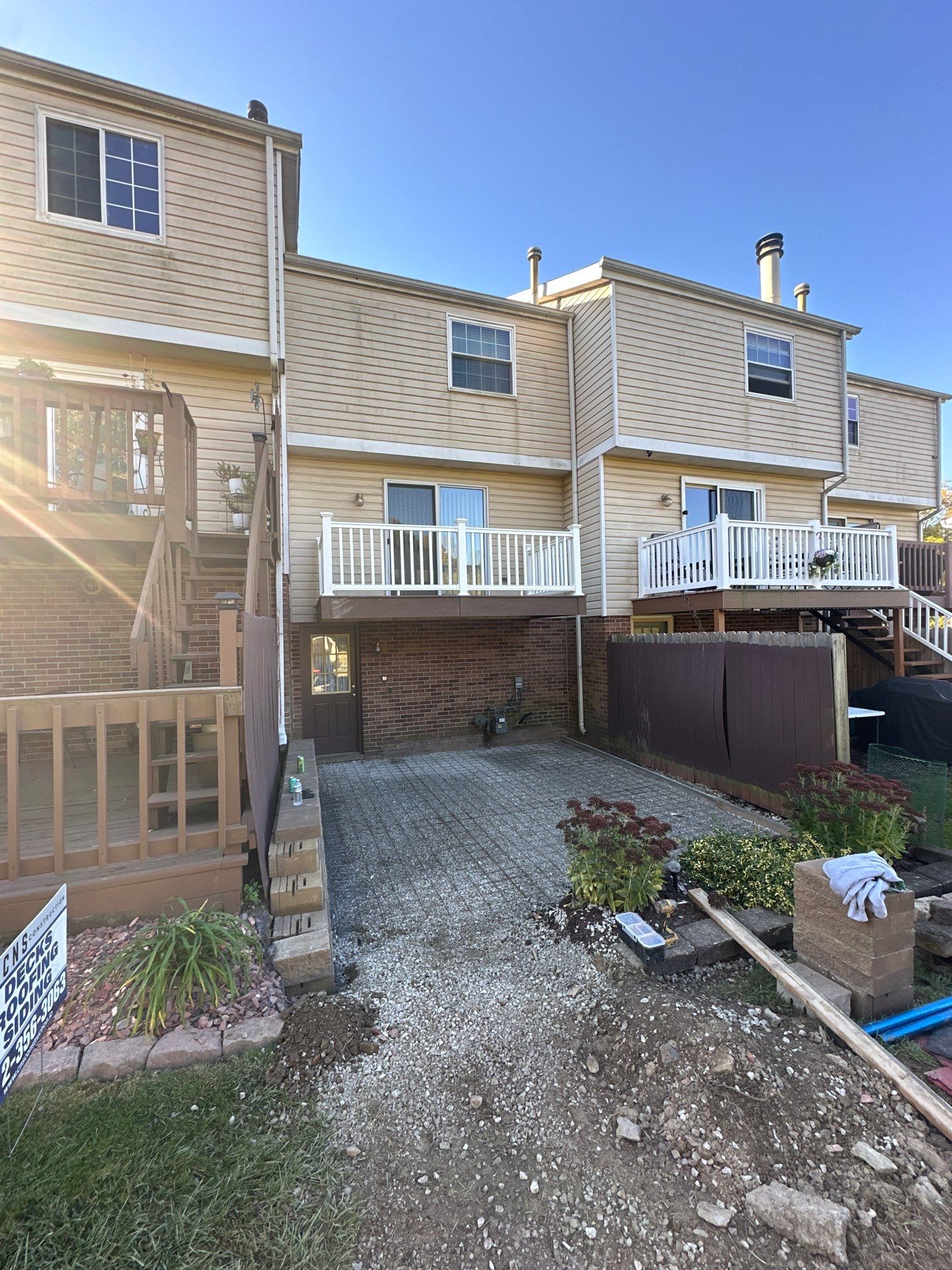 Stamped concrete and redeck  by Cousins Roofing Siding & Decks