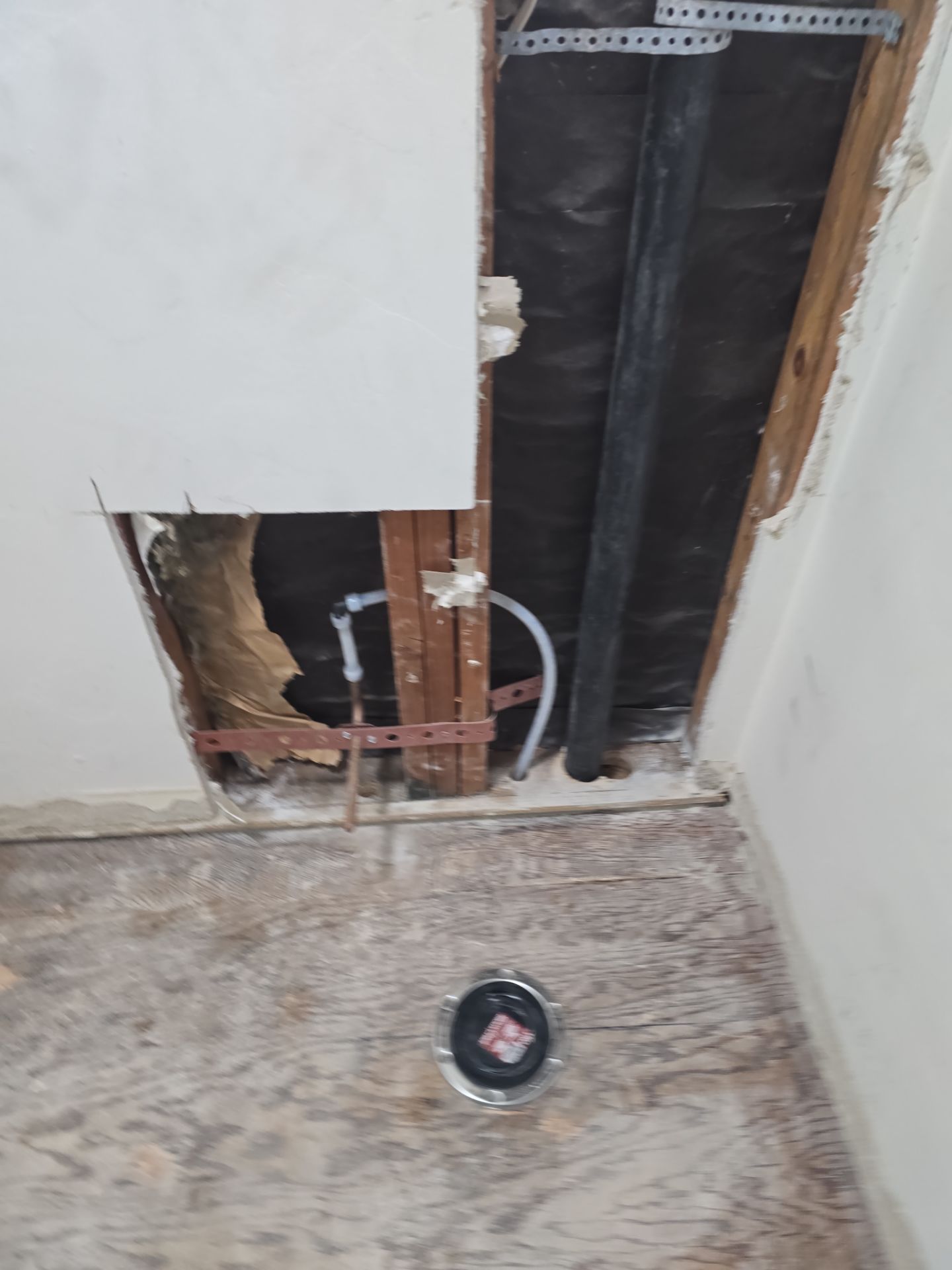 Installation of New Tall Black Piping (Wall to Ceiling) & Underground Piping by Us Plumbing