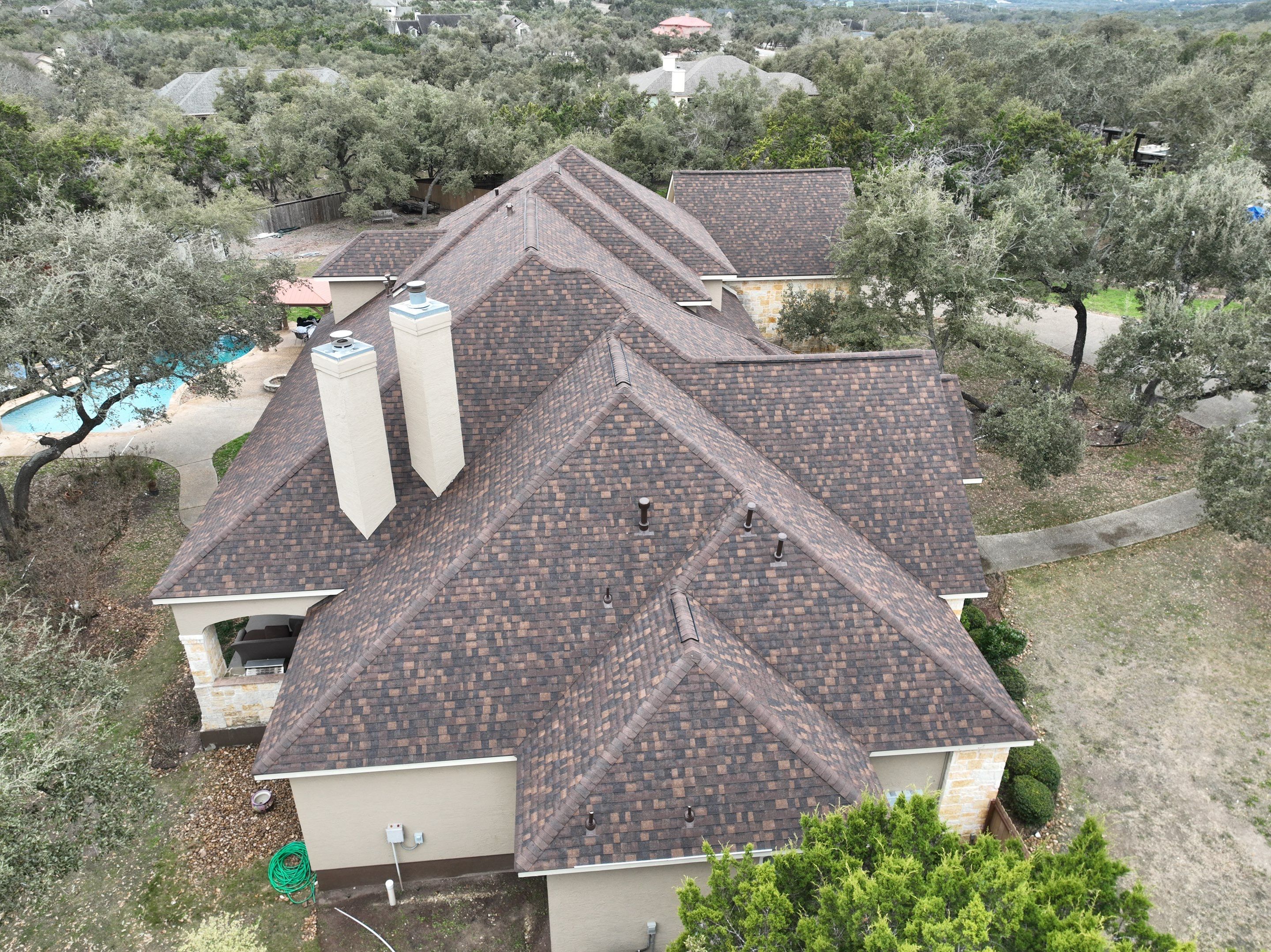 Residential Roof Replacement using 30 Year Laminate Shingles with High Profile Ridge by Premier Roofing and Contracting