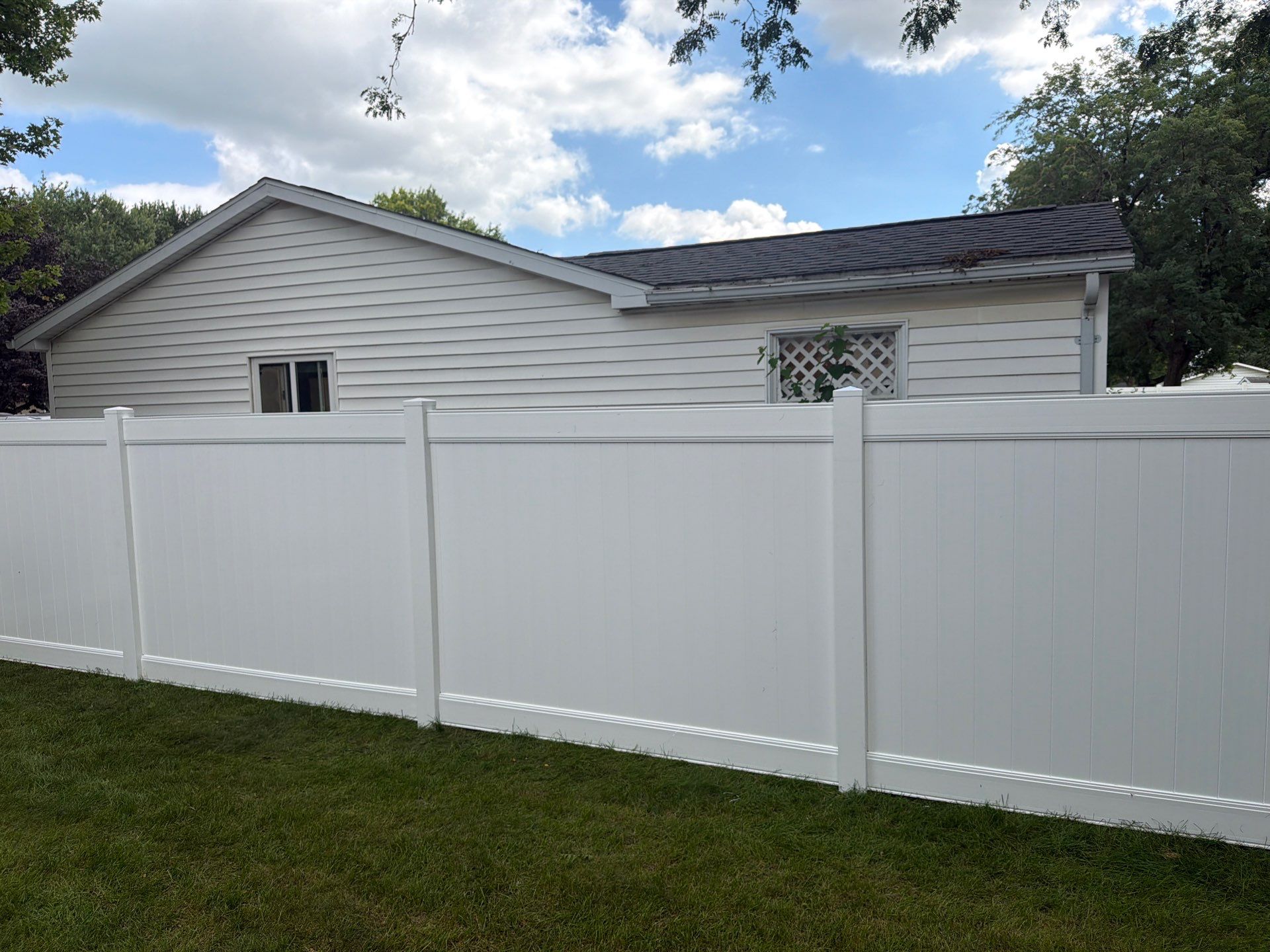 Residential White Vinyl Privacy and Black Chain Link Fencing in Jesup by Perfect Picket Fence and Stain