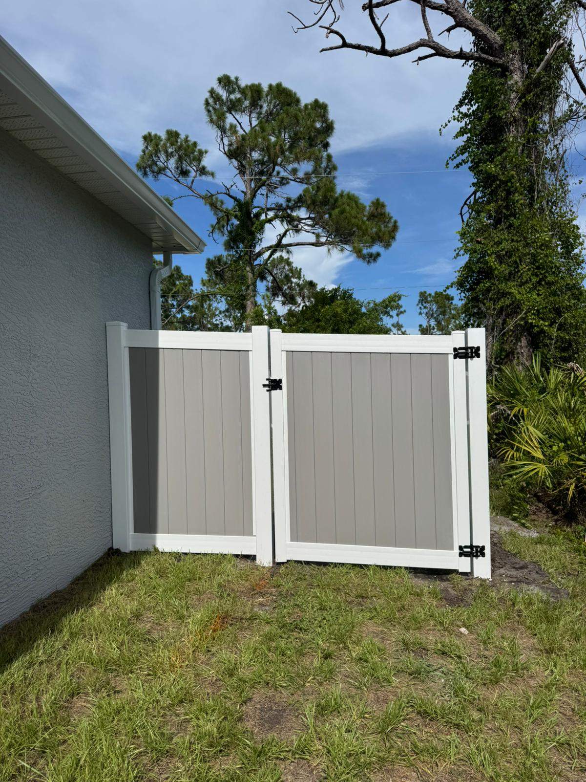 Two-Tone Vinyl Privacy Fence Installation in Port Charlotte by True Fence LLC