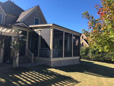 Custom Screened Porch Addition with White Brick Fireplace in Duluth