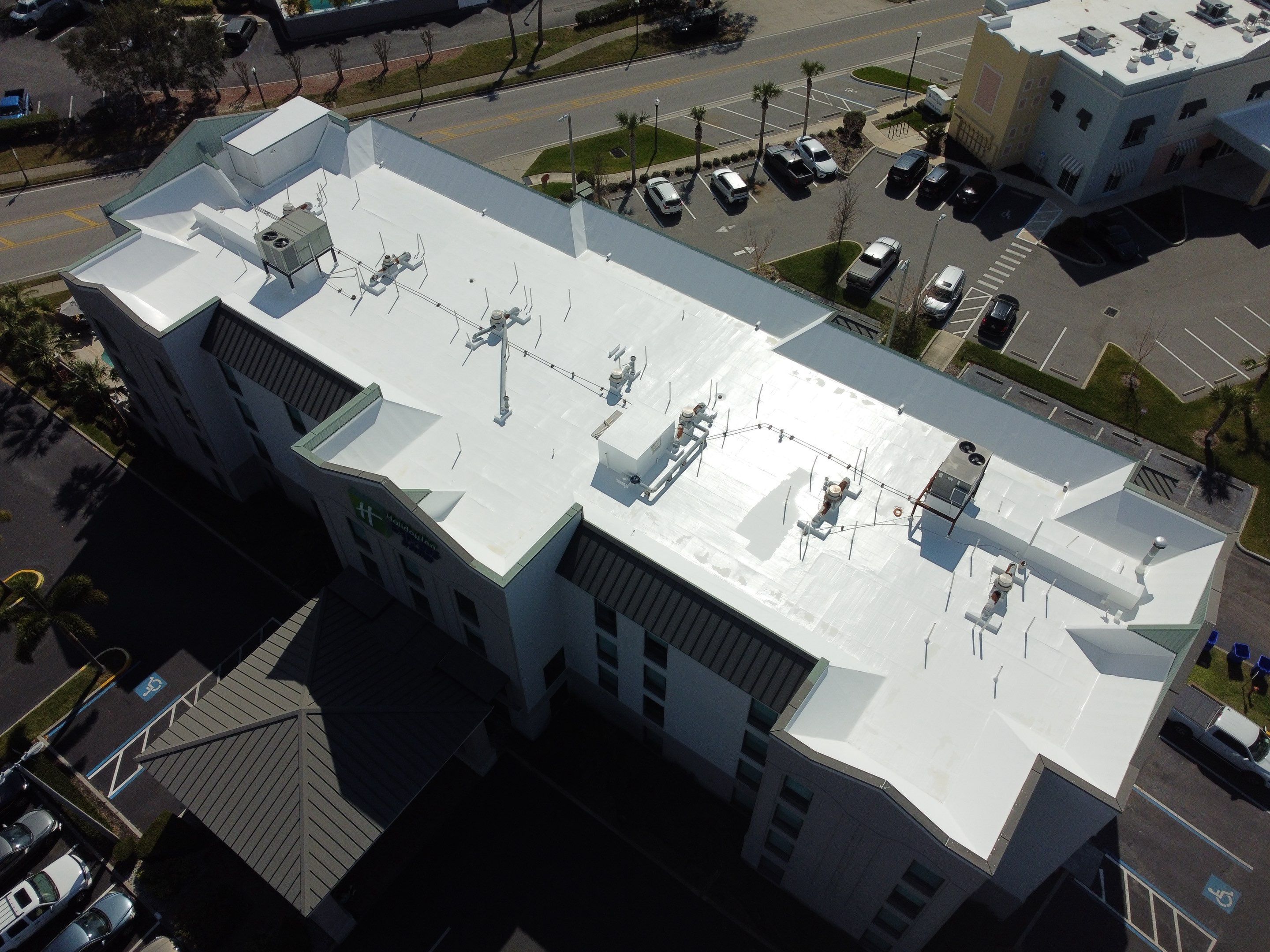 Commercial White Silicone Roof Coating for Hotel in Oldsmar by CES Roofing