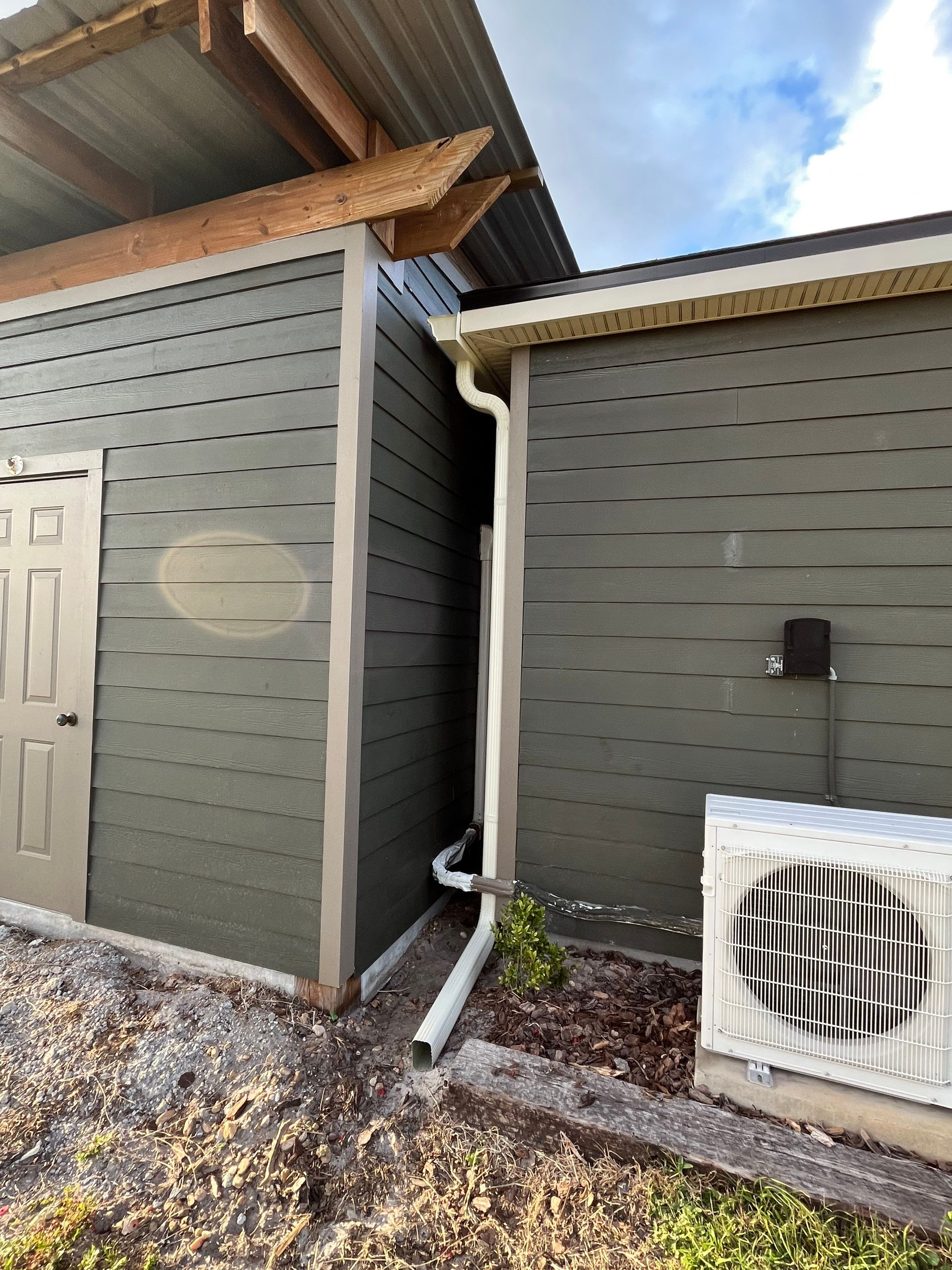  7-inch White seamless gutters and downspouts in Myakka City FL by Gutter Professors
