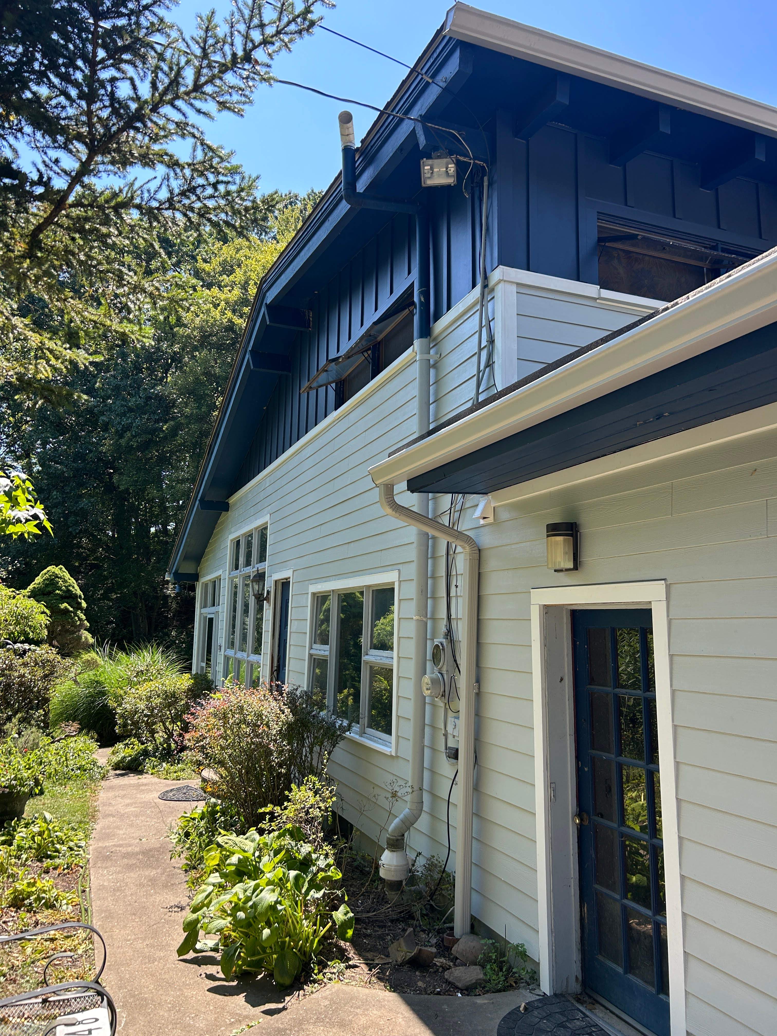 Two-Tone Siding and Sunroom Exterior Remodel in Beaver Falls by Ideal Siding Pittsburgh