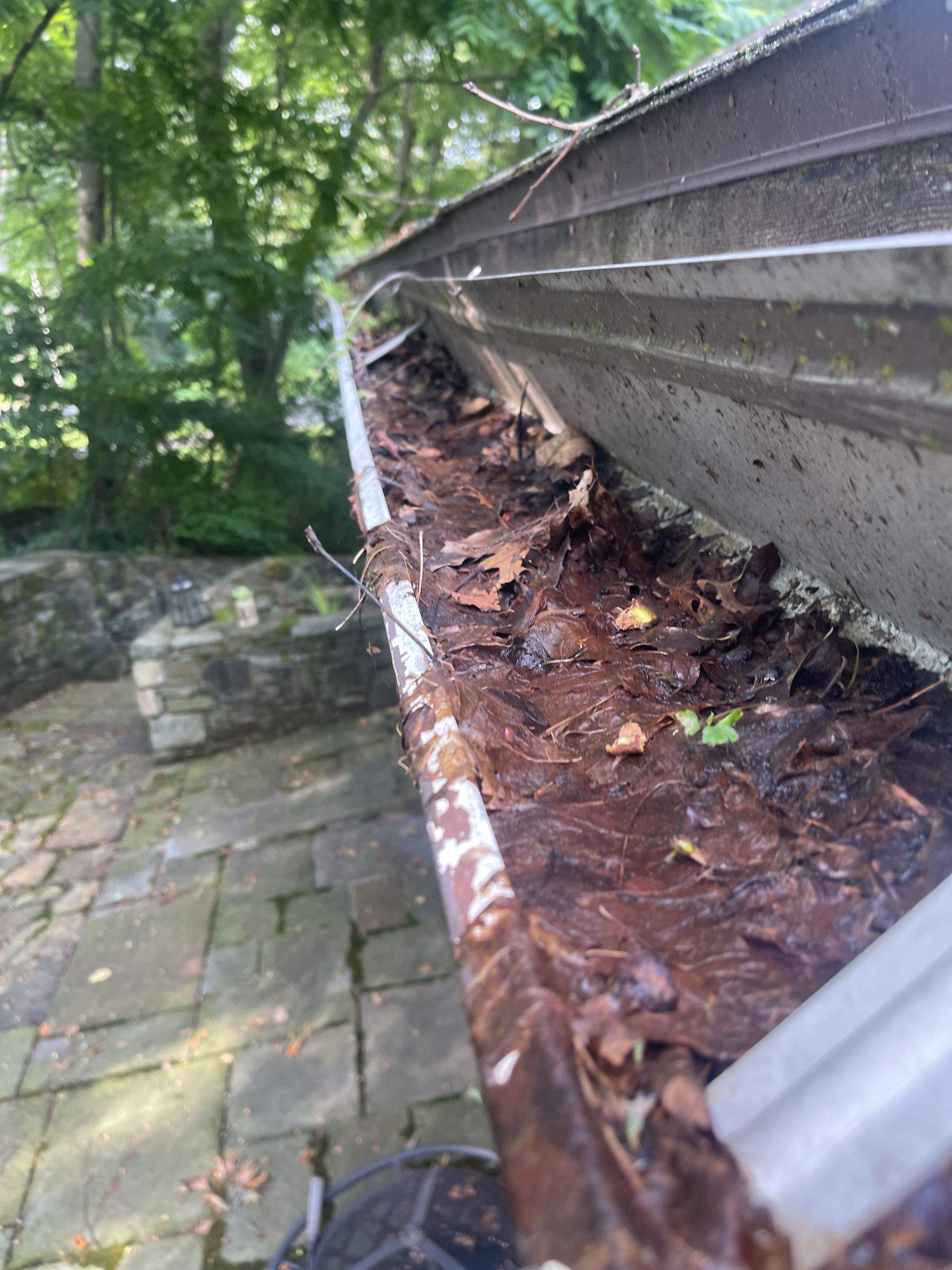 Gutter Installation using 5k Brown Gutters by A Plus Exterior