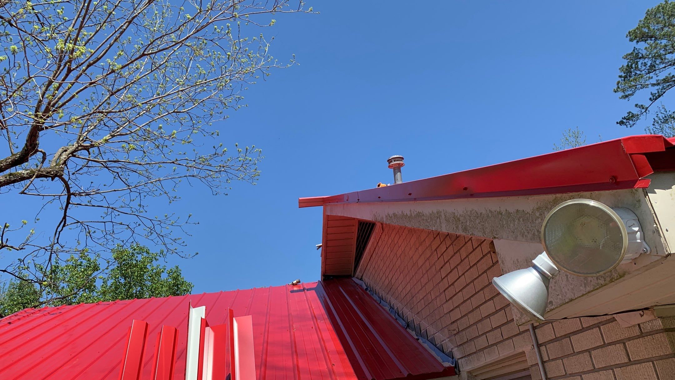 Residential Roofing Installation using 26 Gauge Colored Panels by Hostetler Roofing