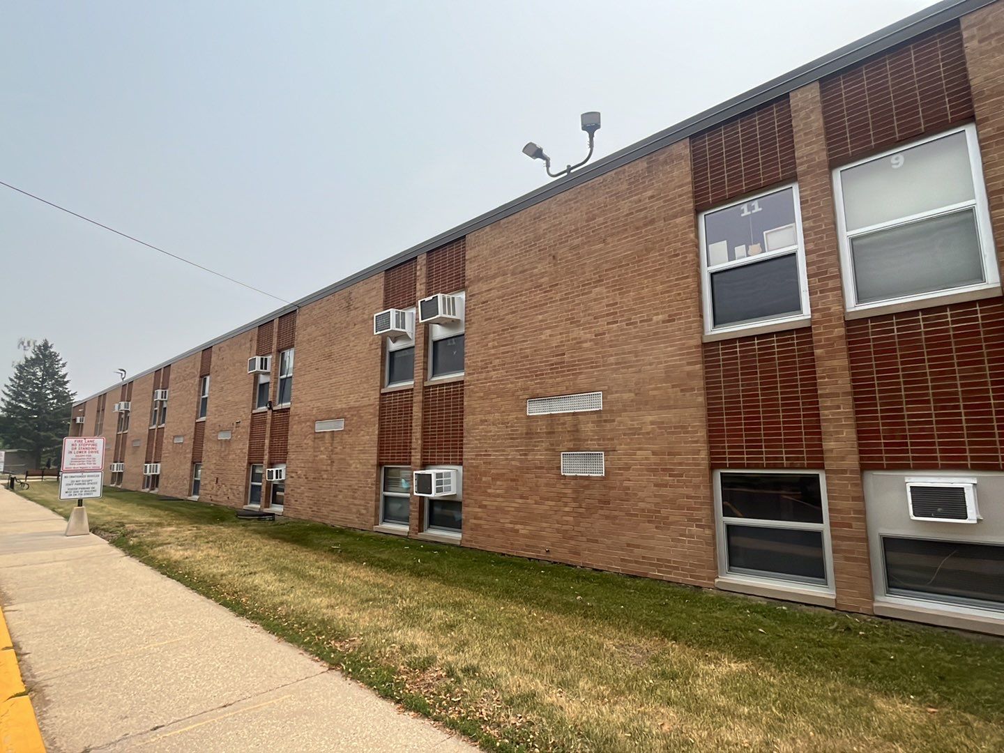 Commercial brick exterior cleaning by Northern Power Washing LLC.