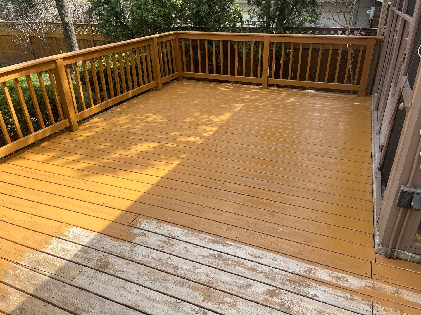 Wood cleaning and staining using Armstrong cloark oil stain by Northern Power Washing LLC.
